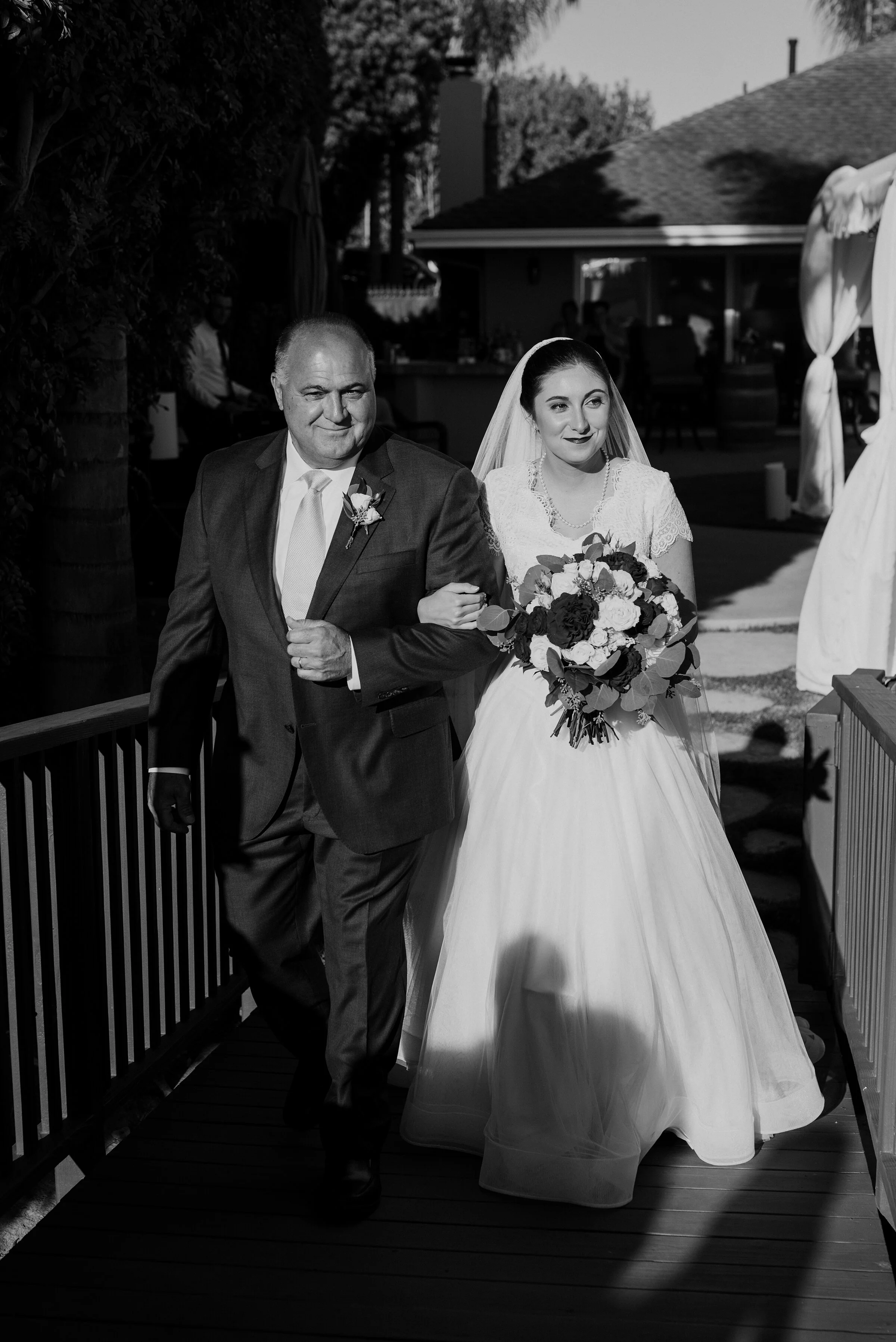  Father of the bride walking his daughter to her lovely backyard wedding in Laguna Beach. Kristi Alyse photography Laguna Beach wedding California brides Logan Utah wedding photographer backyard wedding destination photographer covid wedding bride an