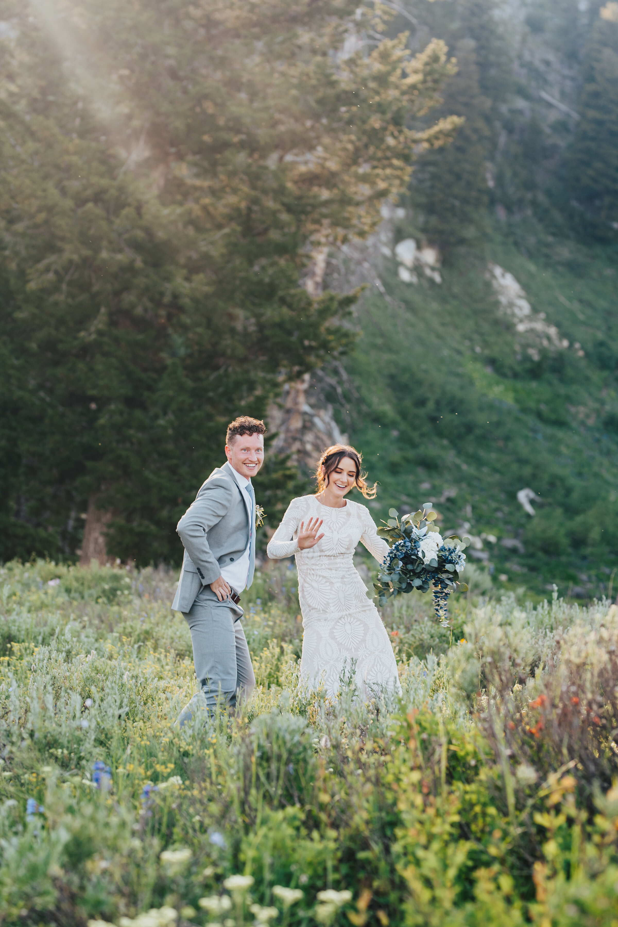  Playful bride and groom in this dreamy wild flower filled meadow for their formals up Logan canyon. Kristi Alyse photography Logan Utah wedding photographer forest nature dreamy formals Logan canyon Tony Grove scenic bridals Northern Utah photograph