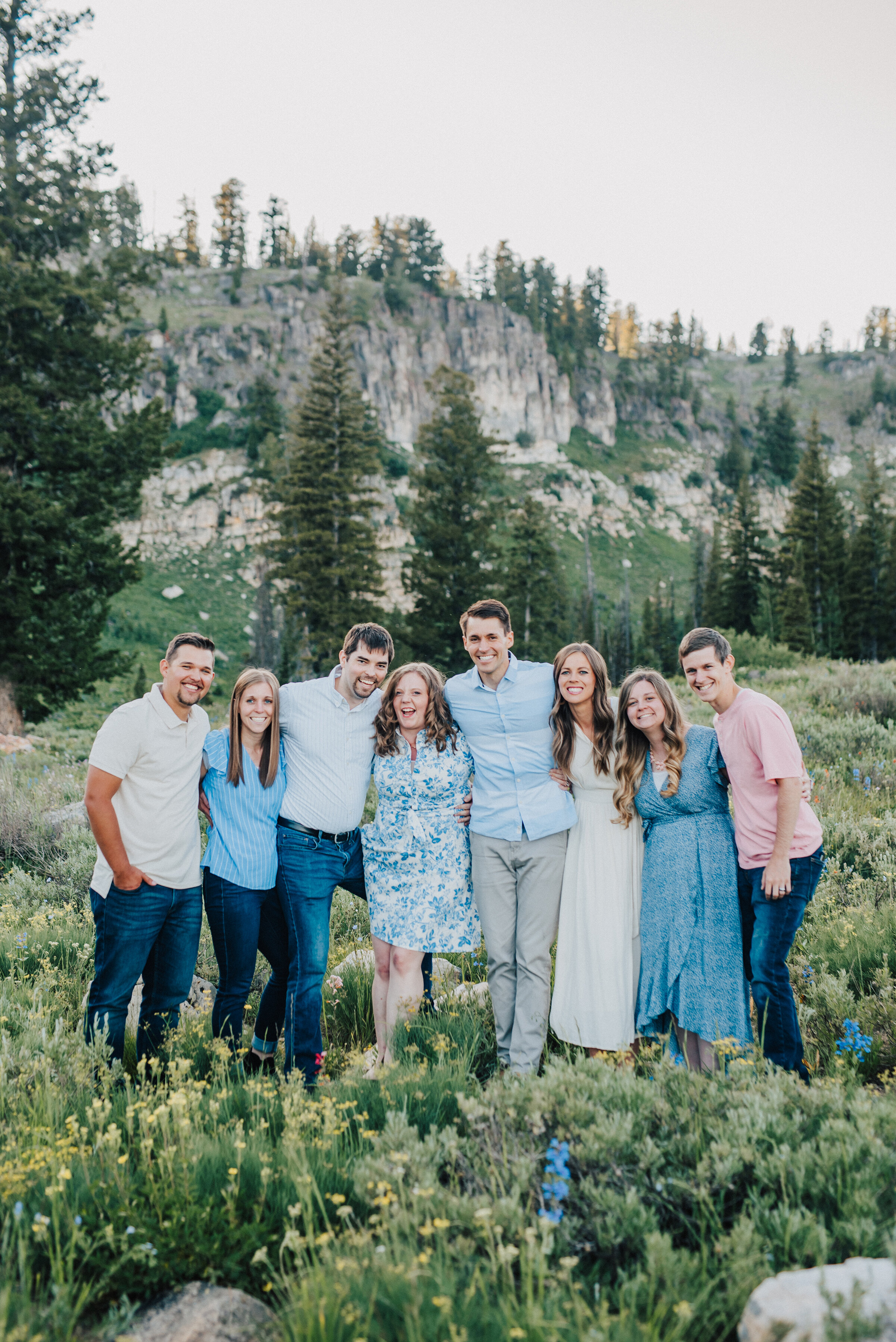 Cute siblings and spouses for this fun family photo session up Logan canyon at Tony Grove. Logan Utah family photographer Kristi Alyse photography Tony Grove forest nature photos Logan canyon light blue family photos wild flowers grand parents children parents spouses reunited dreamy scenic photo shoot #kristialysephotography #utahphotographer #familyphotography #logancanyon #familyphotos #forest #wildflowers #northernutah #familyportraits #family
