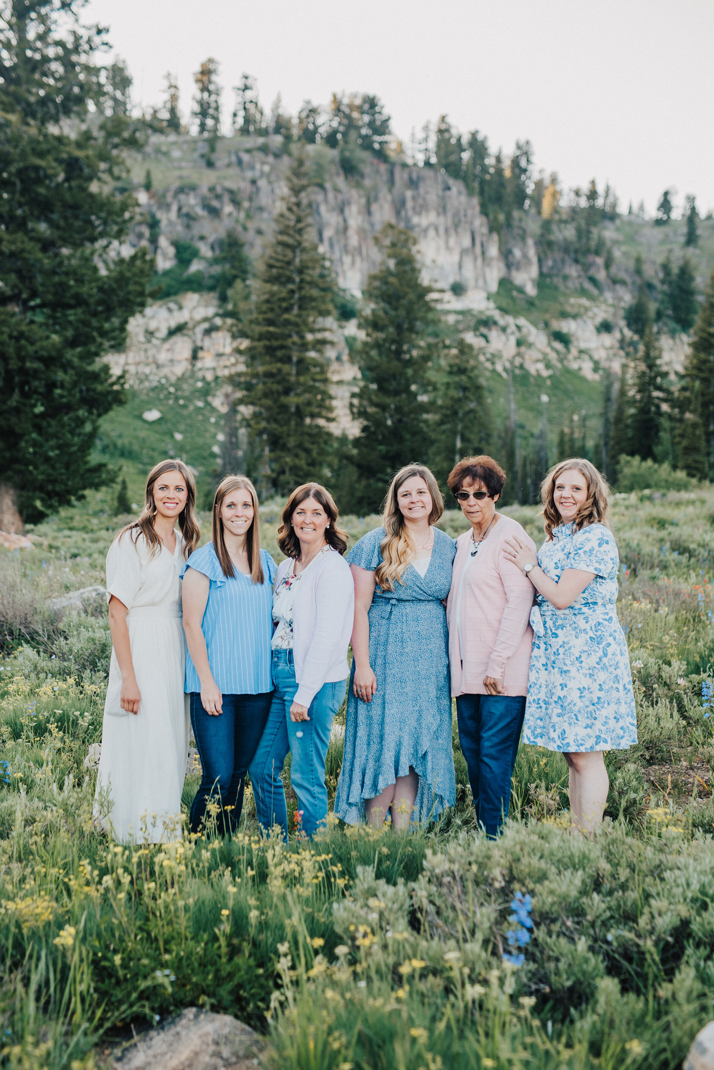  All the ladies together for this dreamy family photo session surrounded by wild flowers and pine trees up Logan canyon. Logan Utah family photographer Kristi Alyse photography Tony Grove forest nature photos Logan canyon light blue family photos wil