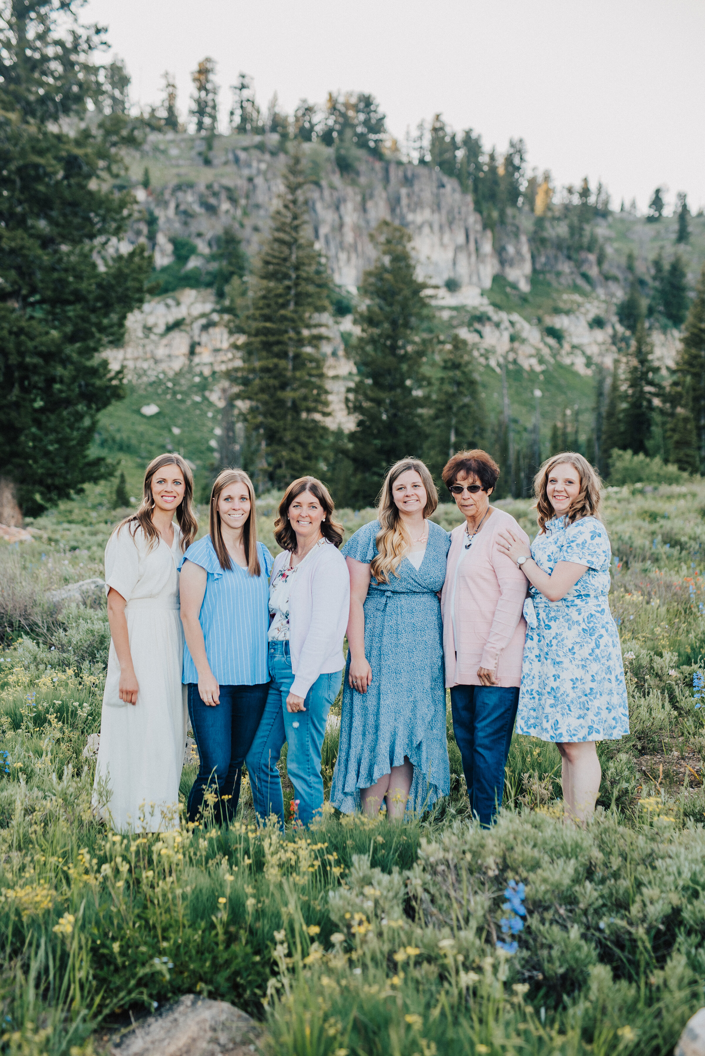  All the ladies together for this dreamy family photo session surrounded by wild flowers and pine trees up Logan canyon. Logan Utah family photographer Kristi Alyse photography Tony Grove forest nature photos Logan canyon light blue family photos wild flowers grand parents children parents spouses reunited dreamy scenic photo shoot #kristialysephotography #utahphotographer #familyphotography #logancanyon #familyphotos #forest #wildflowers #northernutah #familyportraits #family 