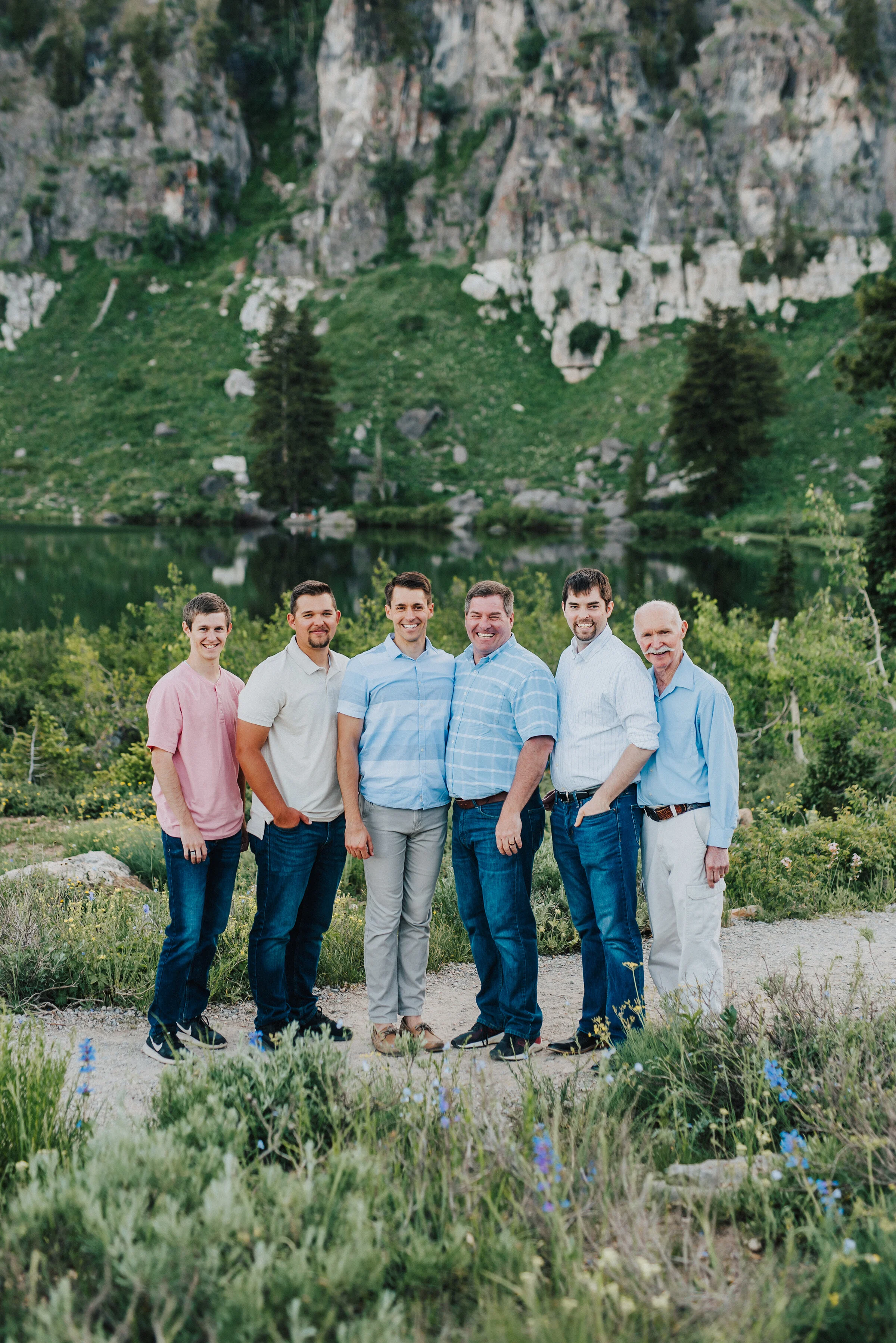  Three generations together for this loving family photo session up Logan canyon. Logan Utah family photographer Kristi Alyse photography Tony Grove forest nature photos Logan canyon light blue family photos wild flowers grand parents children parent