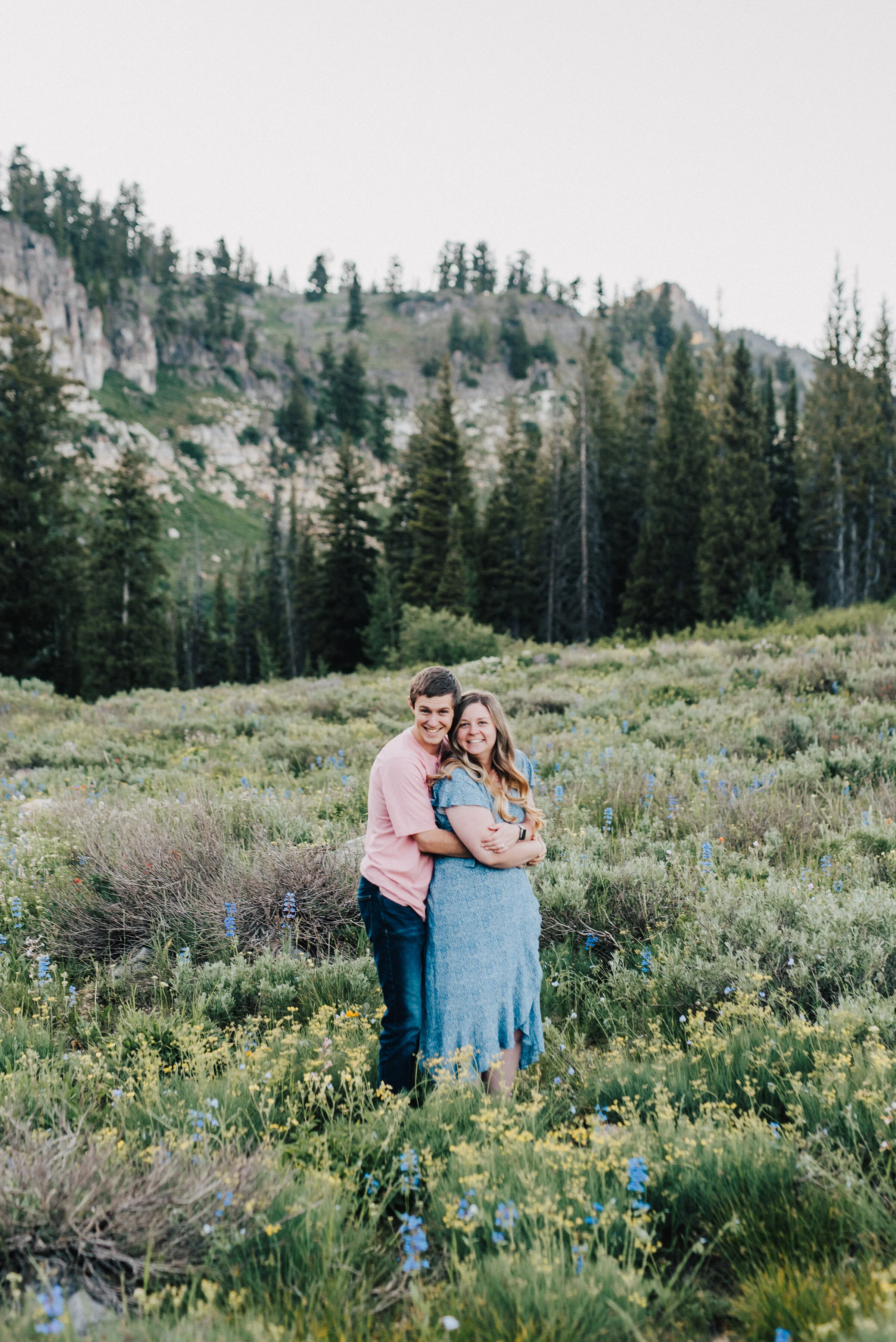  Sweetest couple surrounded by wild flowers at this lovely family photoshoot up Logan canyon. Logan Utah family photographer Kristi Alyse photography Tony Grove forest nature photos Logan canyon light blue family photos wild flowers grand parents chi