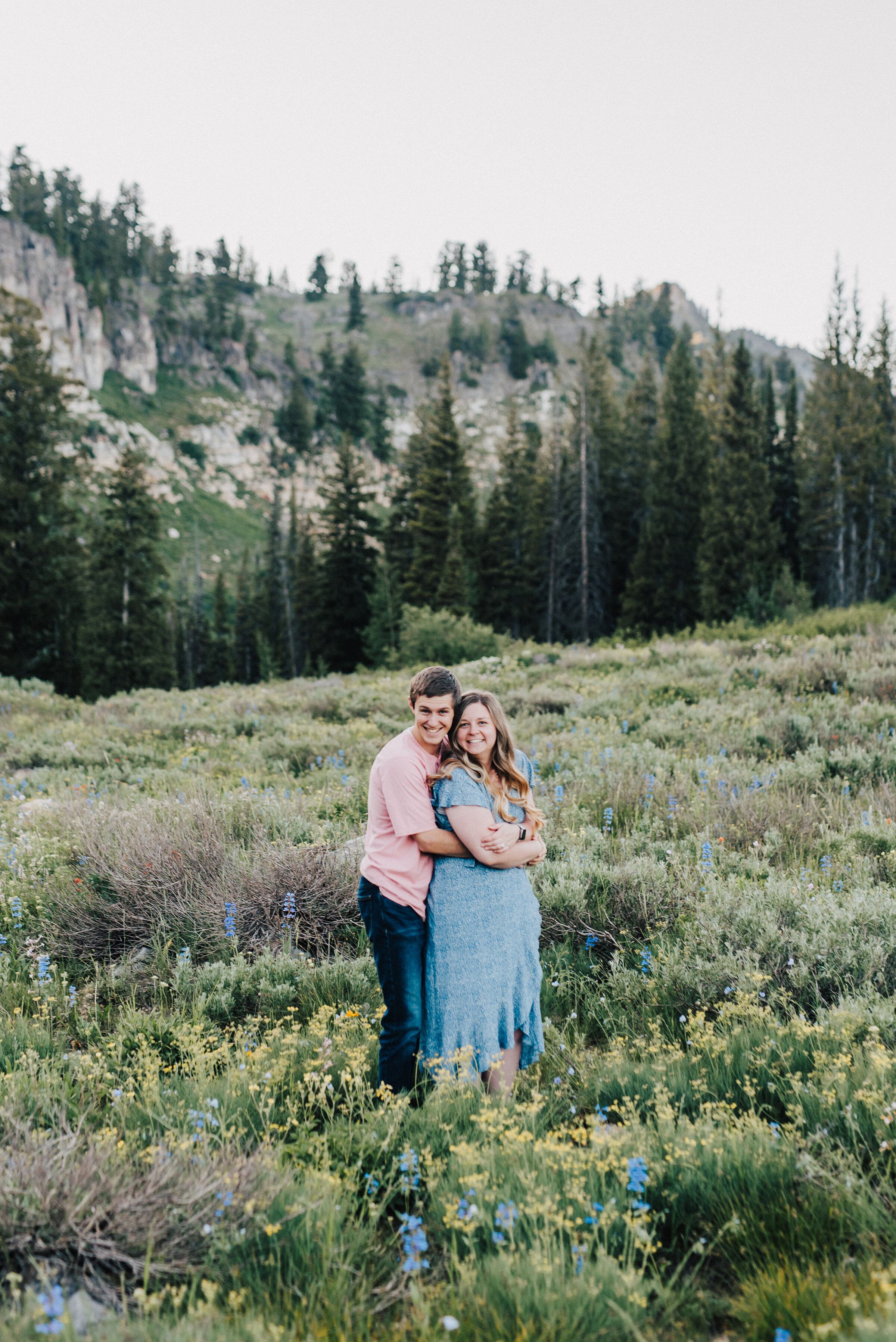  Sweetest couple surrounded by wild flowers at this lovely family photoshoot up Logan canyon. Logan Utah family photographer Kristi Alyse photography Tony Grove forest nature photos Logan canyon light blue family photos wild flowers grand parents children parents spouses reunited dreamy scenic photo shoot #kristialysephotography #utahphotographer #familyphotography #logancanyon #familyphotos #forest #wildflowers #northernutah #familyportraits #family 