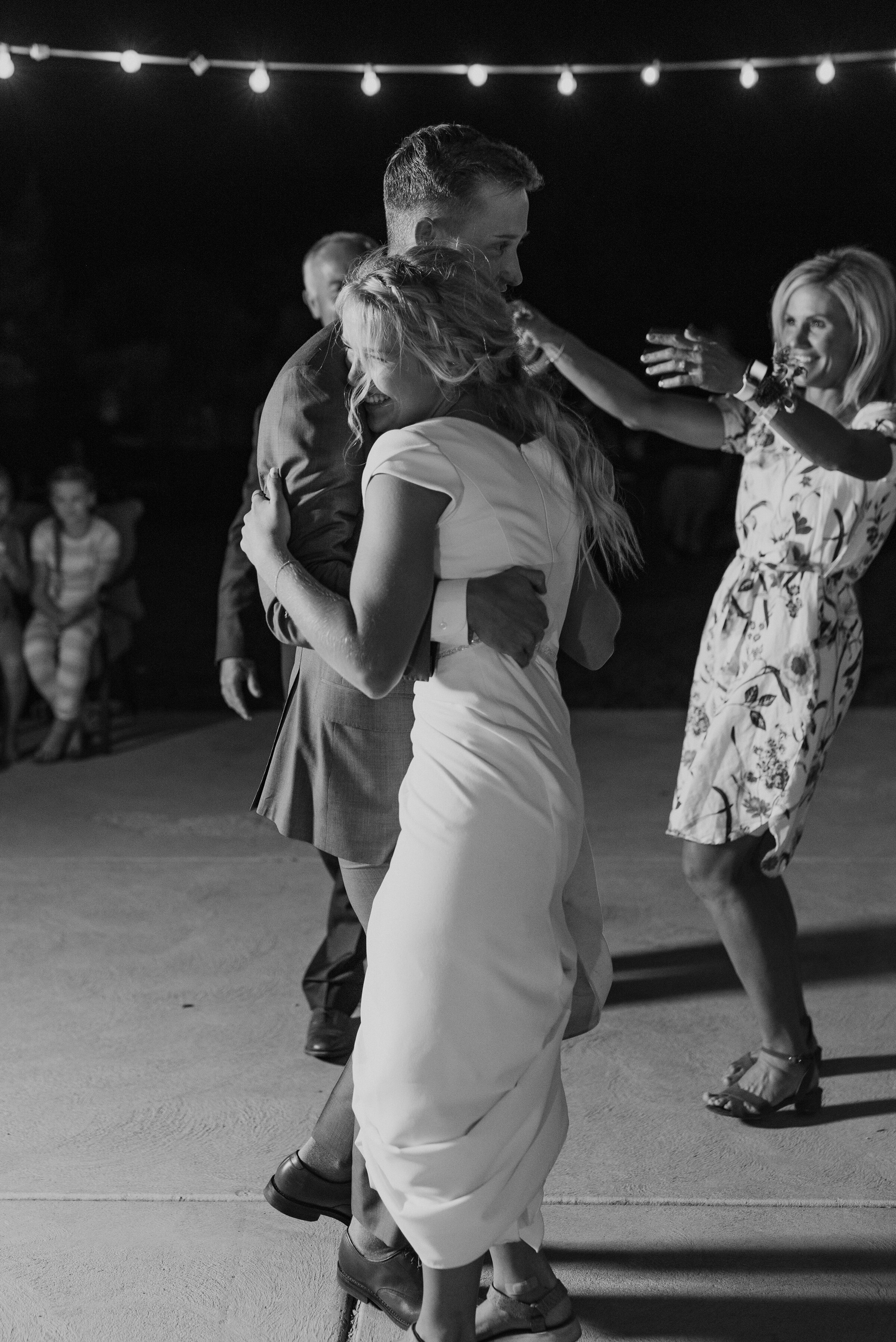  Bride and Groom slow dancing at their dreamy backyard wedding in Park City. Kristi Alyse Photography Logan Utah photographer Park City wedding photographer Drive-Thru wedding COVID wedding neon signs socially distant wedding bride and groom first da