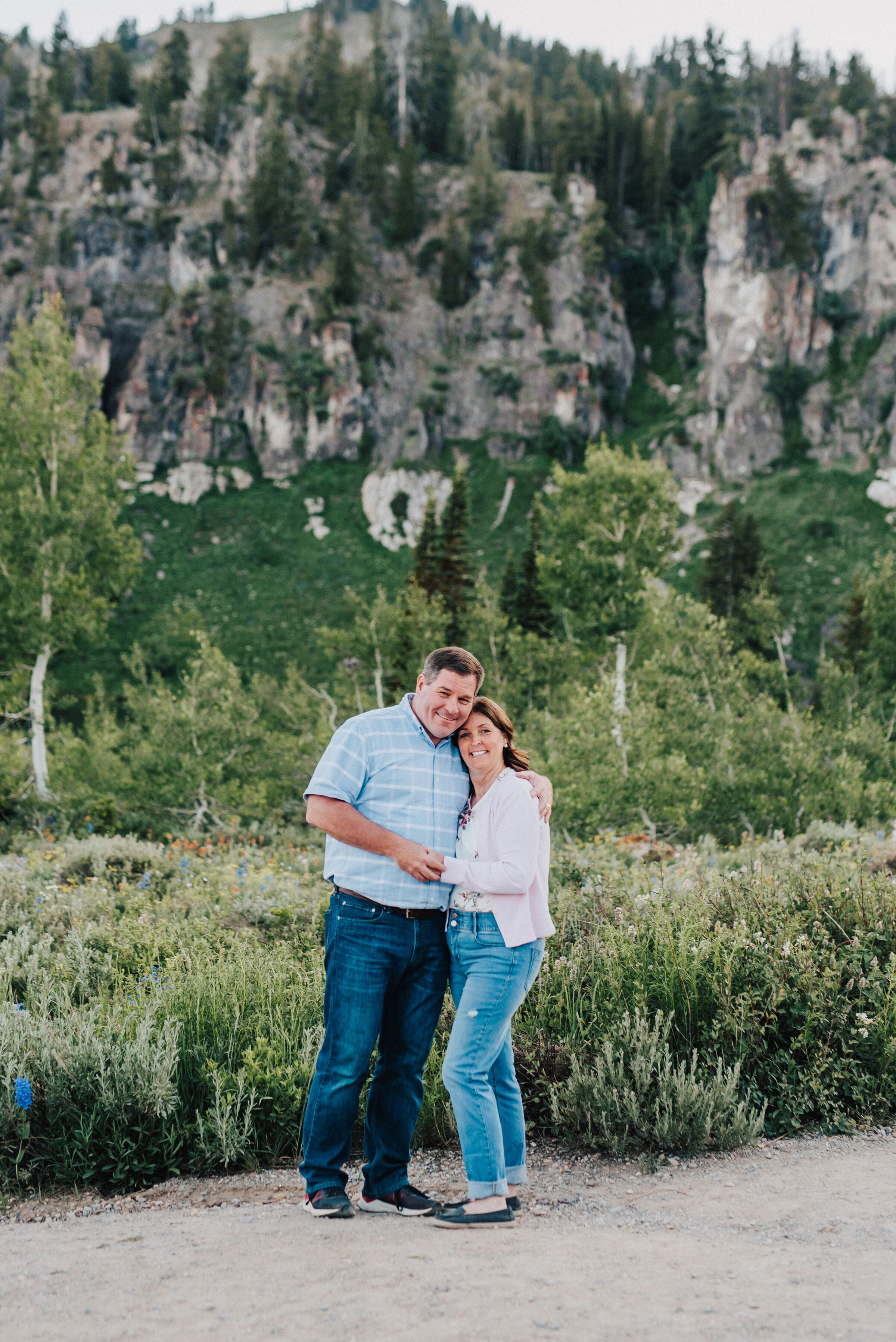 Loving mom and dad up Logan canyon for this scenic family photoshoot. Logan Utah family photographer Kristi Alyse photography Tony Grove forest nature photos Logan canyon light blue family photos wild flowers grand parents children parents spouses r…