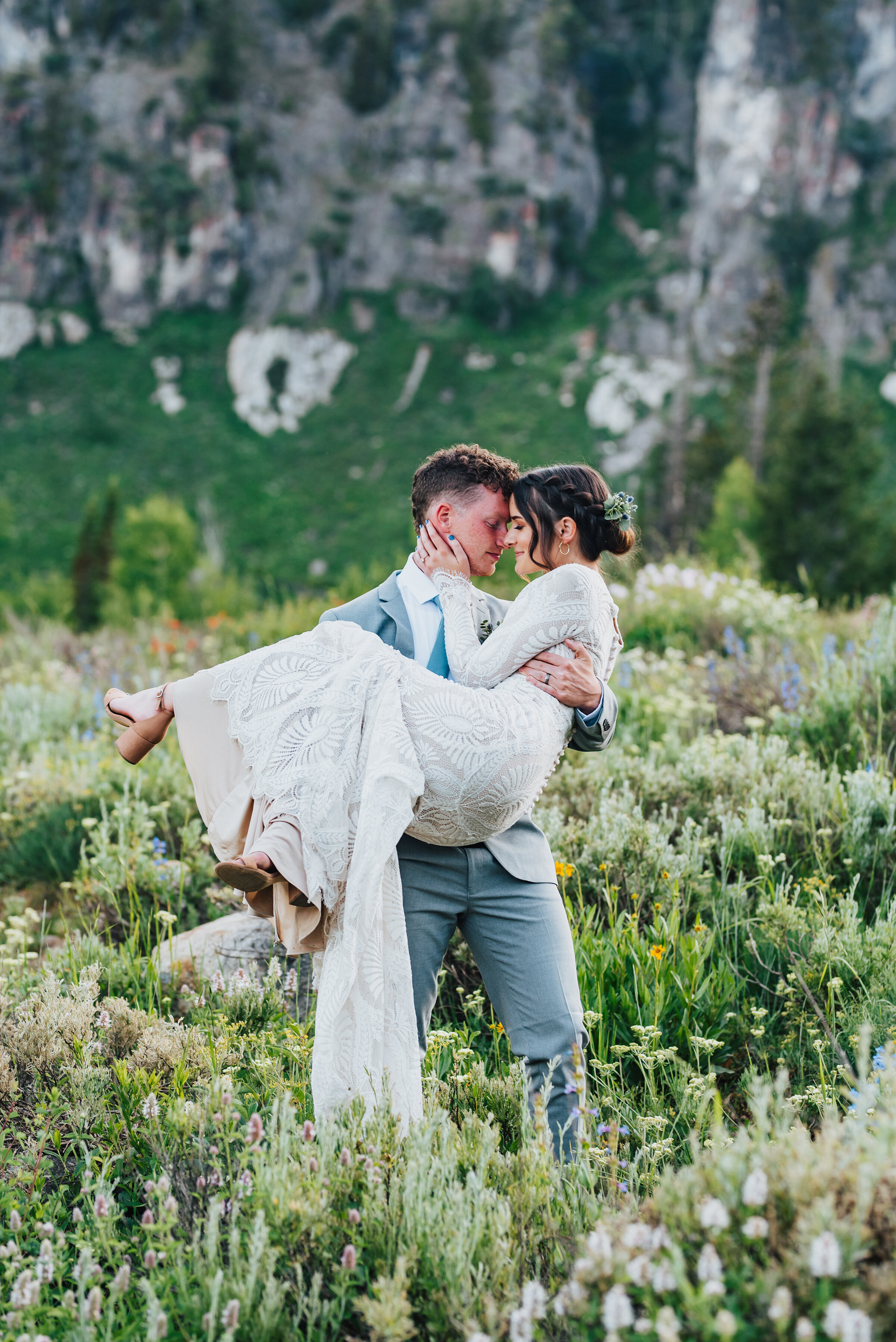 Stunning couple surrounded by wild flowers during their formals up Logan canyon. Kristi Alyse photography Logan Utah wedding photographer forest nature dreamy formals Logan canyon Tony Grove scenic bridals Northern Utah photographer Utah brides brid…