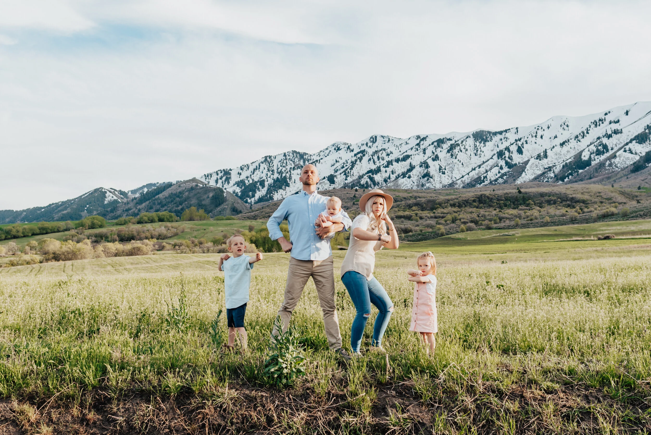 Logan Utah family poses like superheroes in the Wellsville mountains for personality-filled image. Family photoshoot small children in family photos Utah photography Logan Utah photographer Utah family photography Kristi Alyse Photography family pho…