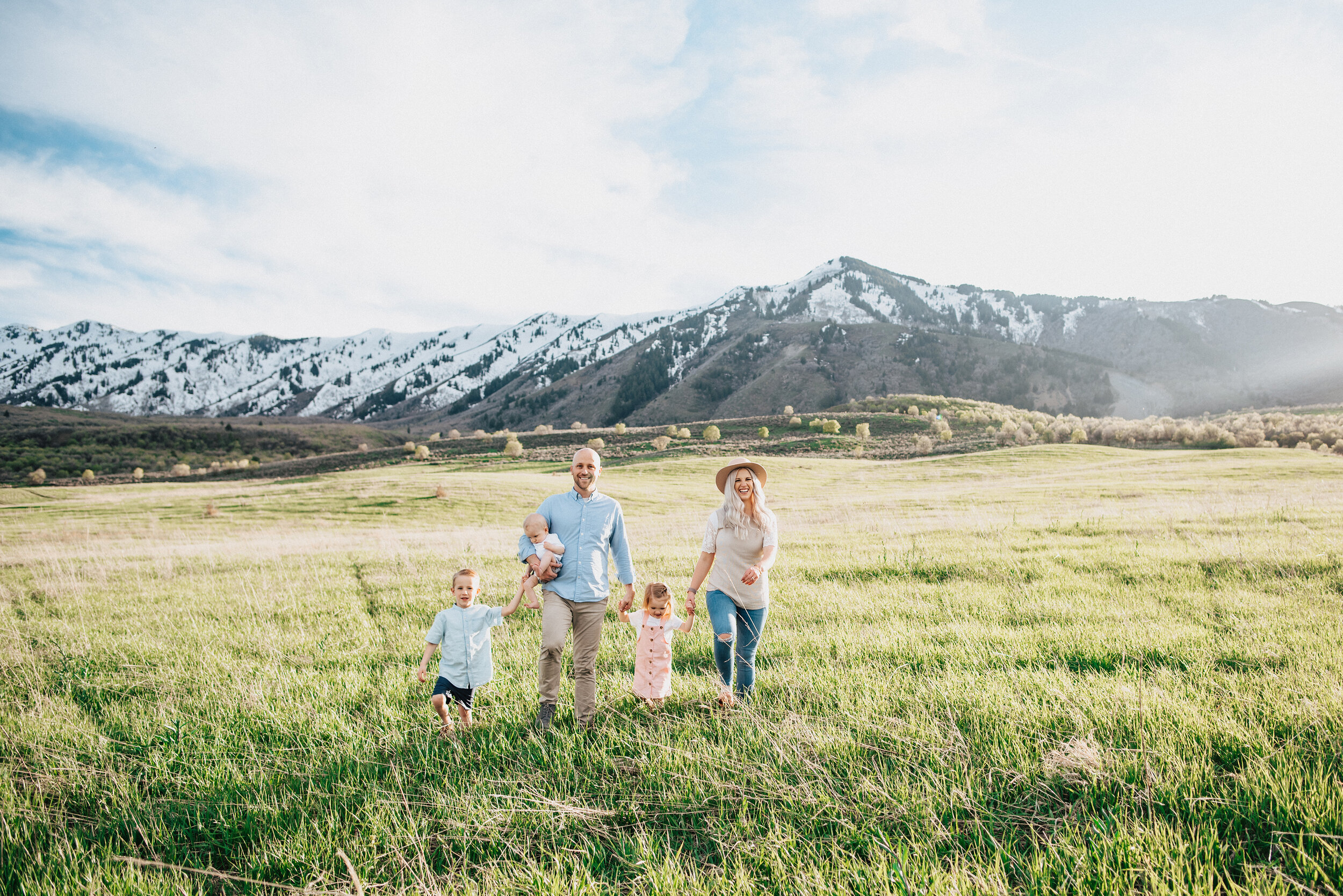  Family of five stands in the middle of a meadow in the wellsville mountains near logan utah. Happy family posing in mountain utah photography holding hands picture kristi alyse photographer family photography mountain family photography locations logan utah #familylove #familyfun #familyday #familyfunday #familytimes #familyselfie #familybond #happyfamily #instafamily #familygram 