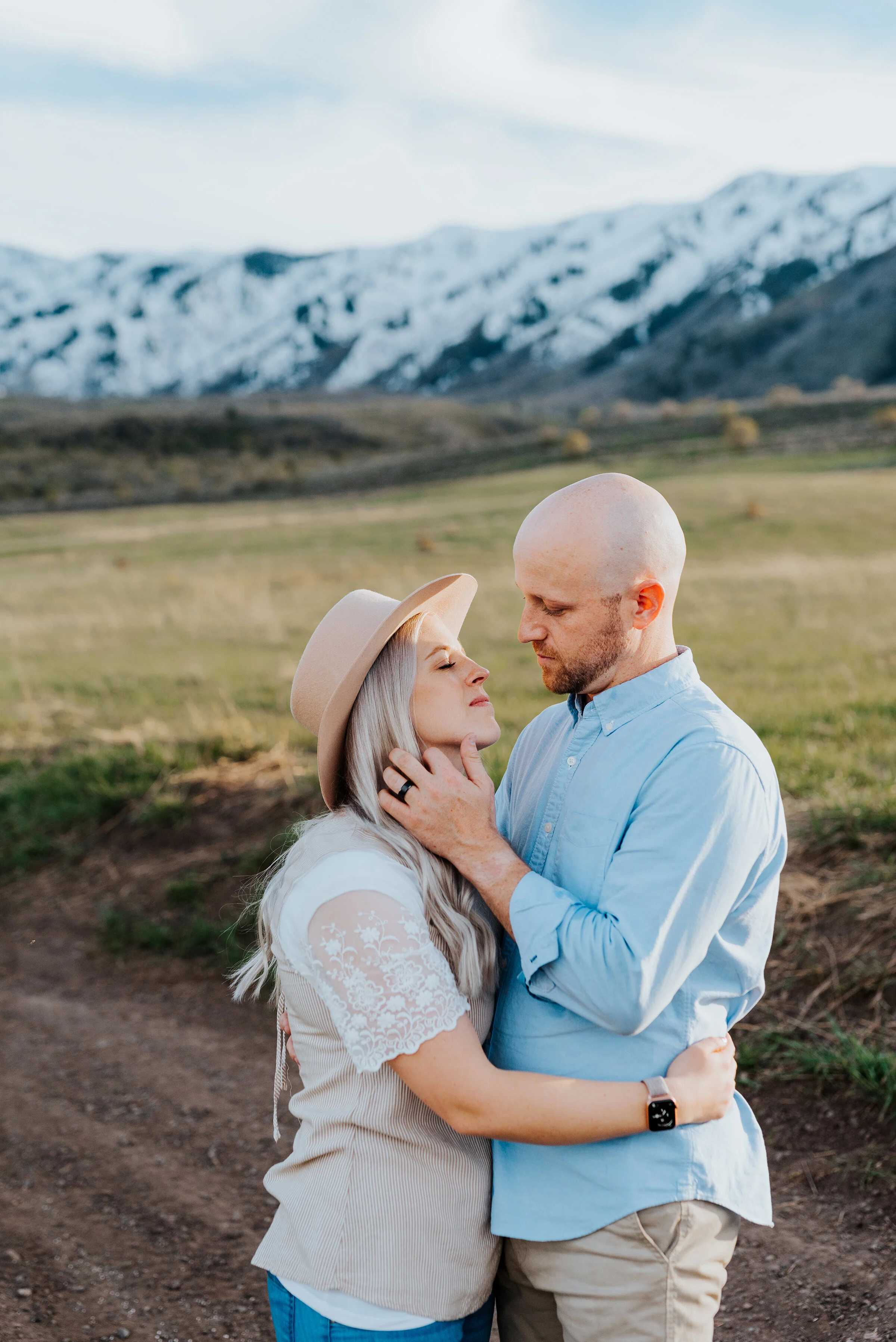  Romantic portraits of a happy couple posing while touching gently in the wellsville mountain range in logan utah. couple photography session romantic family photos mom and dad are in love utah photographer kristi alyse photography happy couple photo