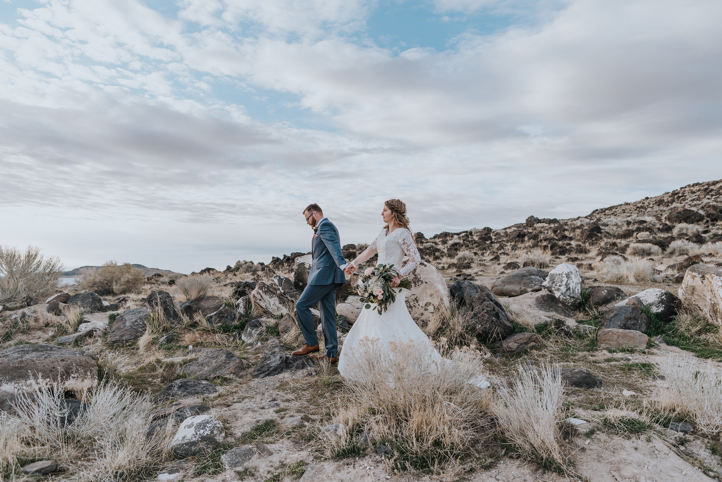 The natural beauty of the Spiral Jetty was complete with dimension and layers much like this stunning bride and groom during their wedding formals. wedding formal photoshoot in Spiral Jetty Northern Utah Great Salt Lake photography wedding formals natural photo aesthetic bride and groom #spiraljetty #utahphotography #weddingformals #gettingmarried #weddingattire #utahwedding #greatoutdoorswedding #weddingformalsphotoshoot #naturalbeauty