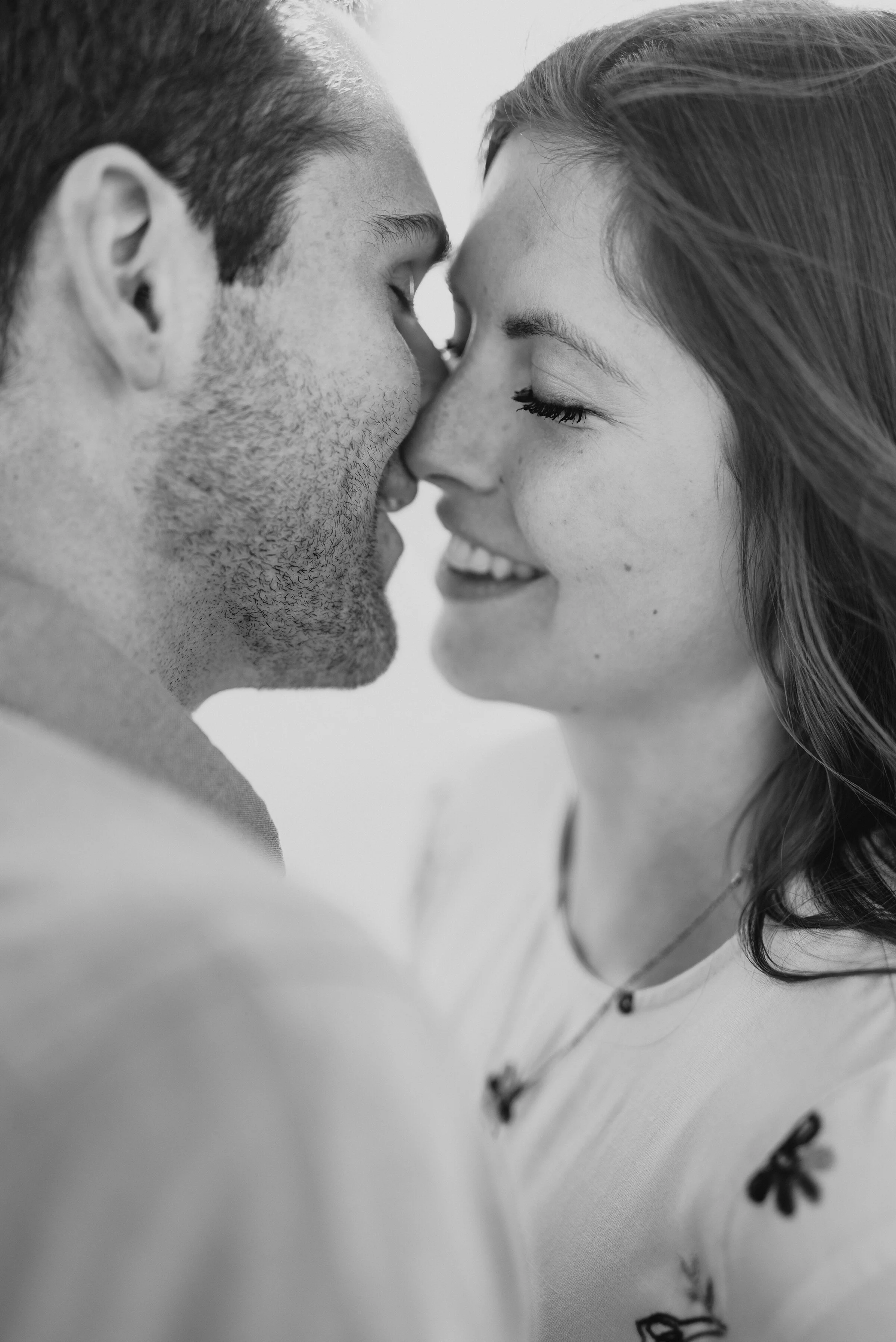  Couple almost kissing in a black and white photo from their engagement session in Magna Utah on the Salt Flats. Black and white photography inspiration utah engagement photoshoot in Magna Utah local photography session locations salt flat photograph