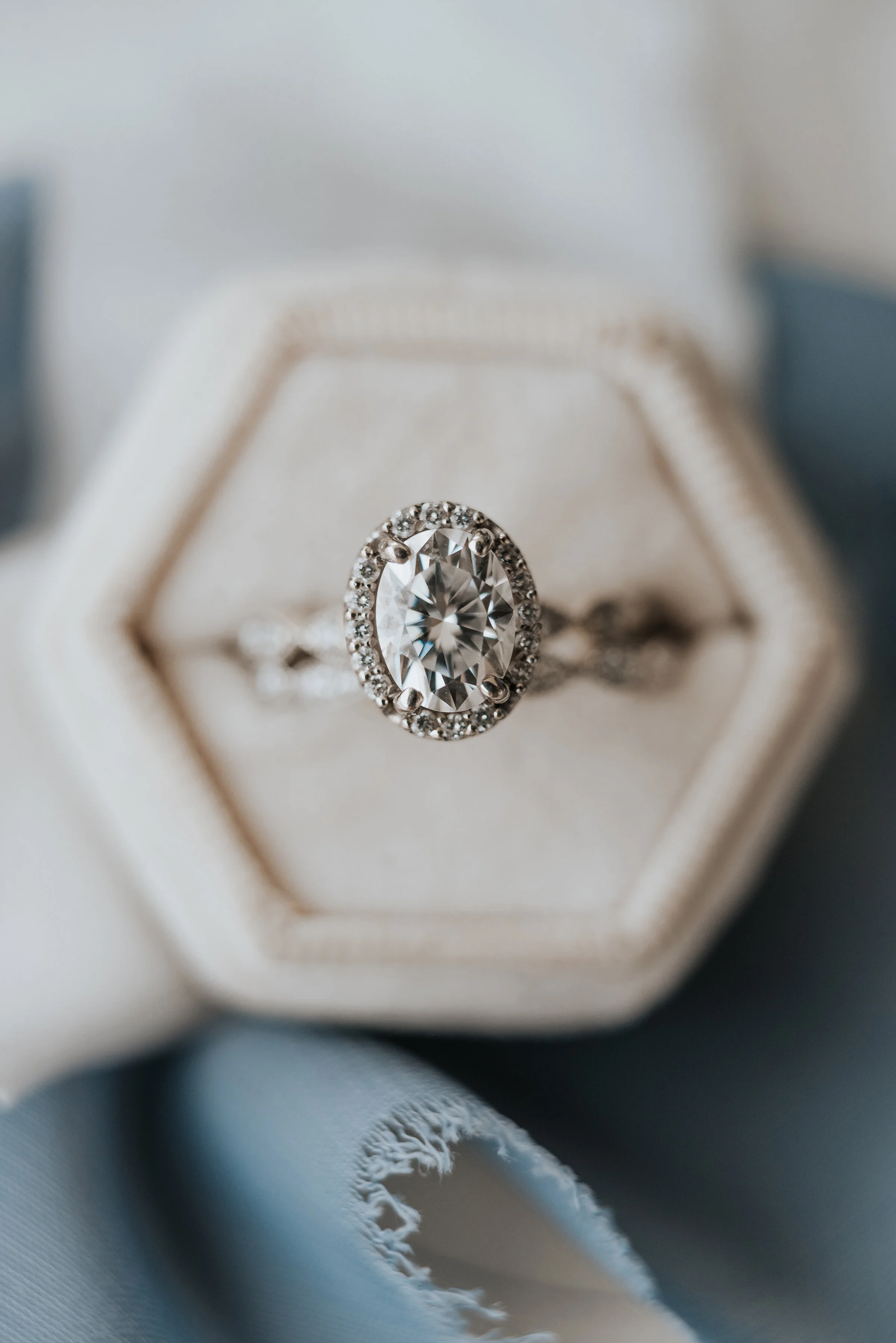  Brides wedding ring set in a diamond halo and placed in the most gorgeous white ring box that allows each diamond to shine. Wedding ring photoshoot in Ephraim Utah photography wedding outdoor location western inspired rustic Airbnb photo aesthetic #