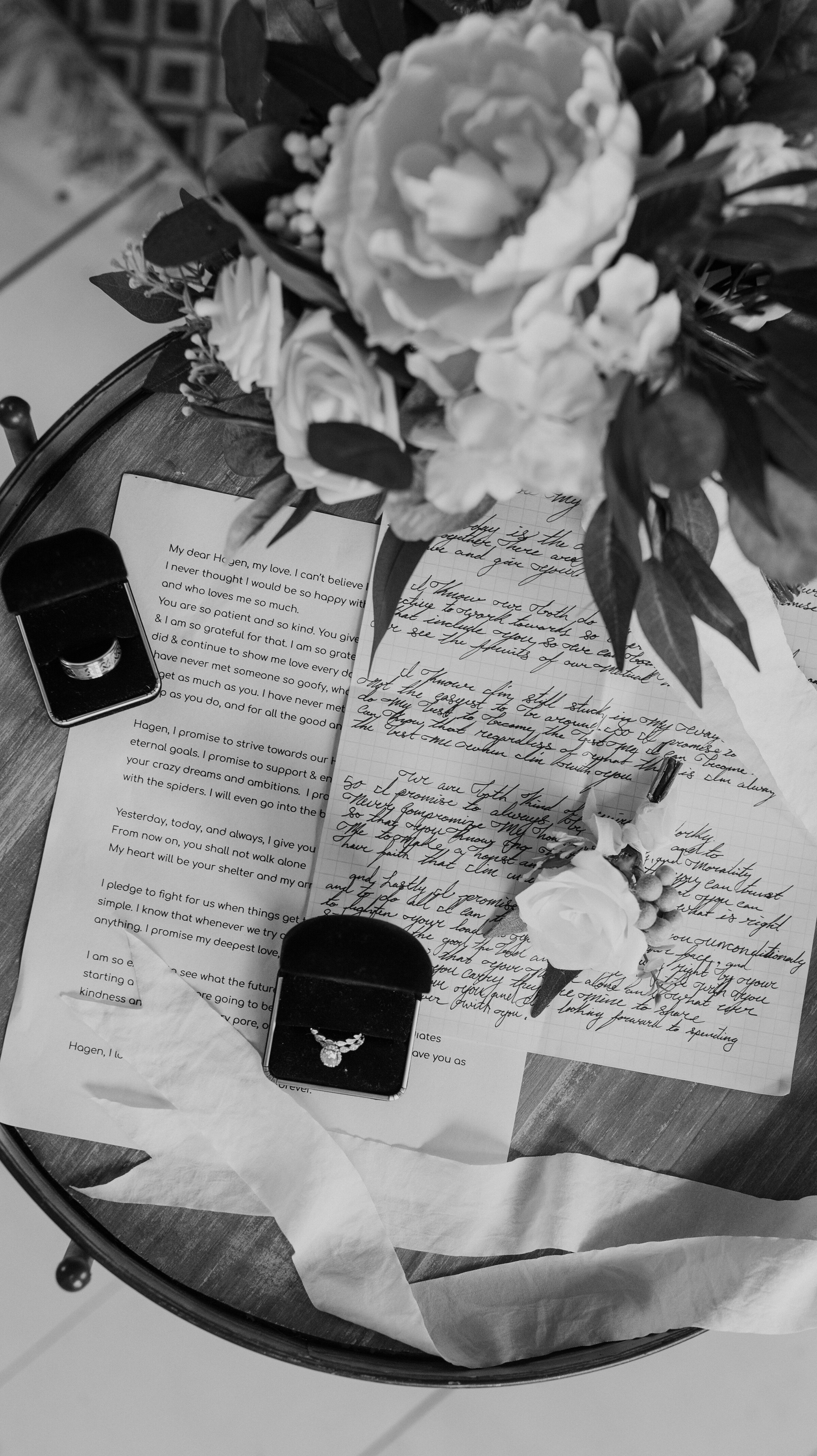  Wedding day details photographed by Kristy Alyse Photography including the wedding program, the bride’s wedding ring and the flowers from her bouquet. photoshoot in Ephraim Utah photography wedding outdoor location western inspired rustic Airbnb pho