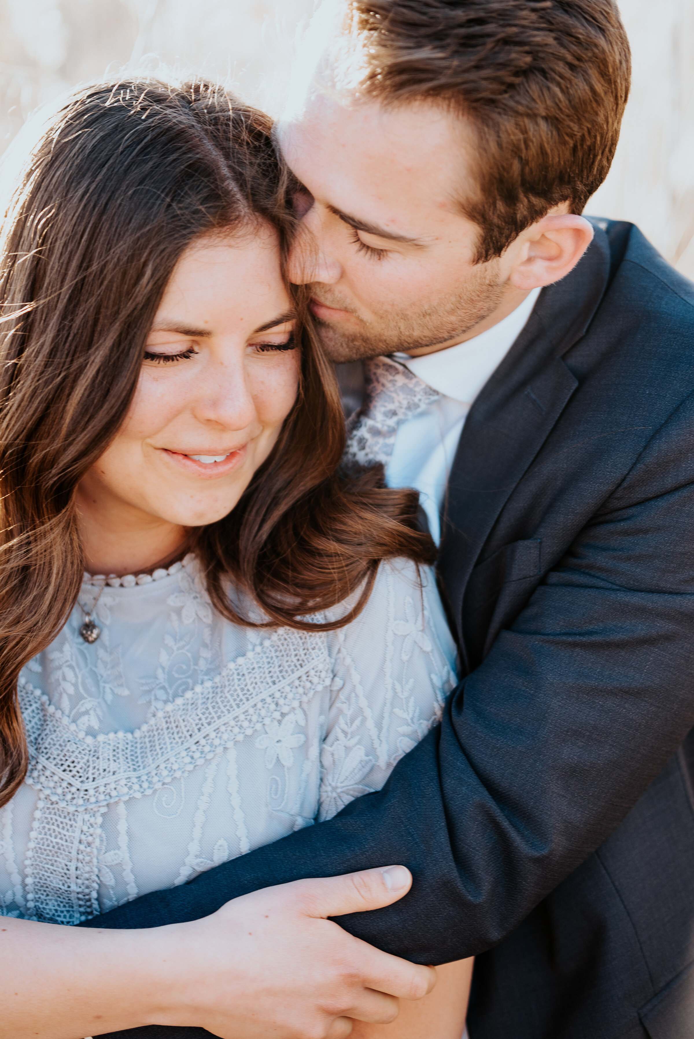  Man kisses his future brides hair in a stunning engagement photo perfect for a custom guest book. Photos by Kristi Alyse Photography stunning engagement inspiration engagement hair ideas formal engagement photoshoot #weddinginspo #engagementinspo #k