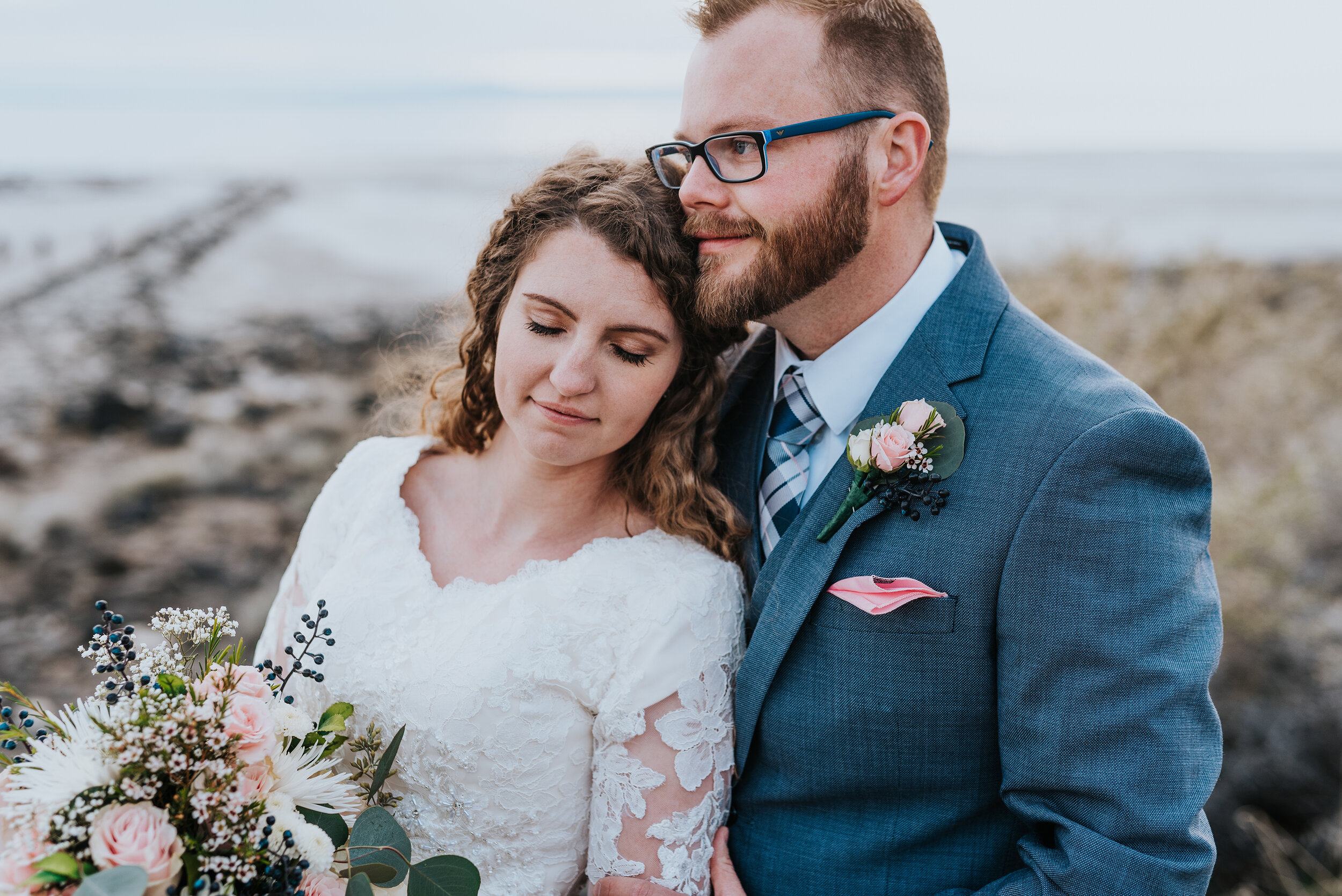  The details this bride and groom displayed were stunning from the light pink pocket square that matched her wedding bouquet to the lace designs on her wedding gown. Stunning wedding formal photoshoot in Spiral Jetty Northern Utah Great Salt Lake photography wedding formals natural photo aesthetic bride and groom #spiraljetty #utahphotography #weddingformals #gettingmarried #weddingattire #utahwedding #greatoutdoorswedding #weddingformalsphotoshoot #naturalbeauty 