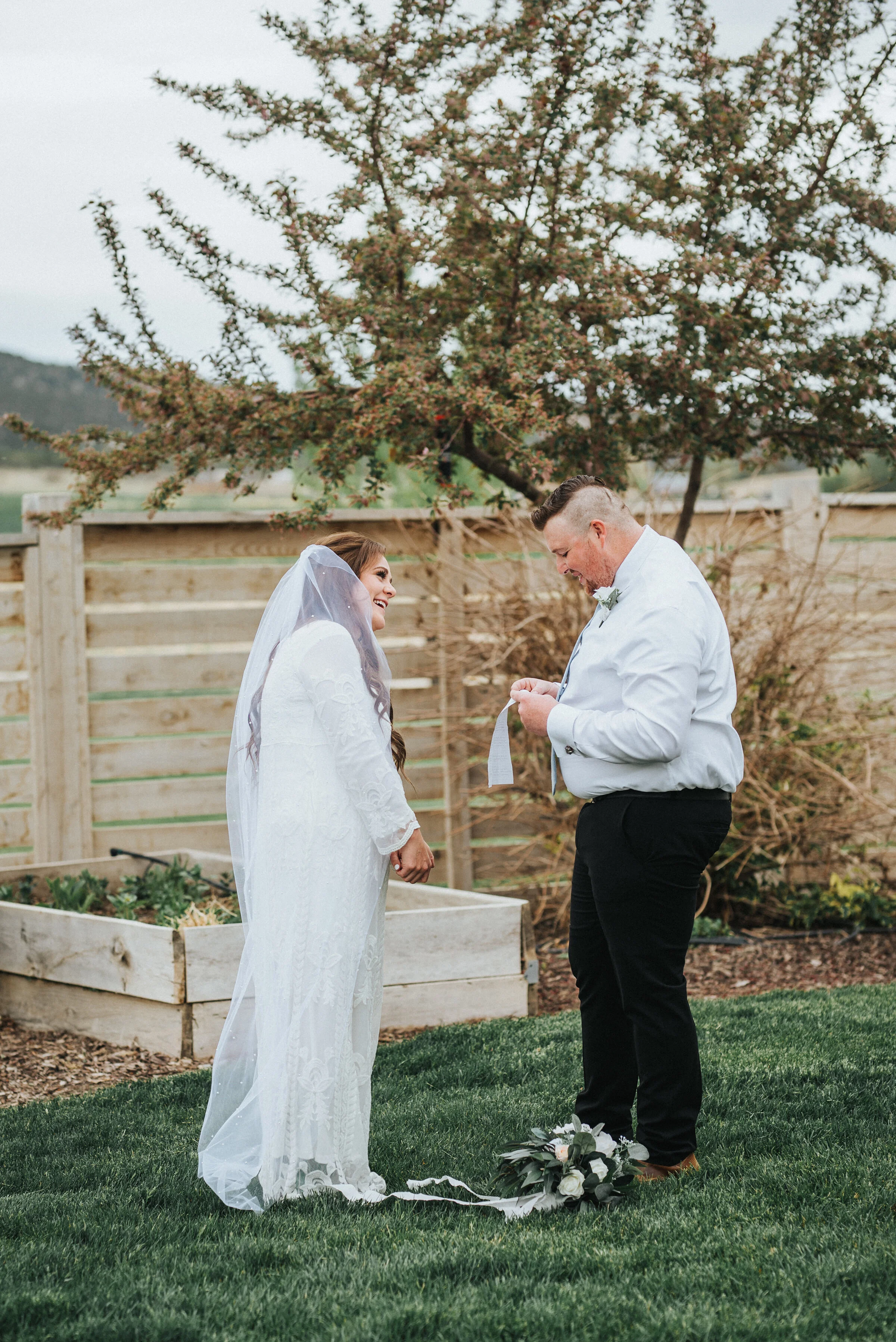  Emotional and tender vow exchange between the bride and groom outside of their Airbnb during their wedding ceremony in Ephraim, Utah. Wedding day photoshoot in Ephraim Utah photography wedding outdoor location western inspired rustic Airbnb photo ae