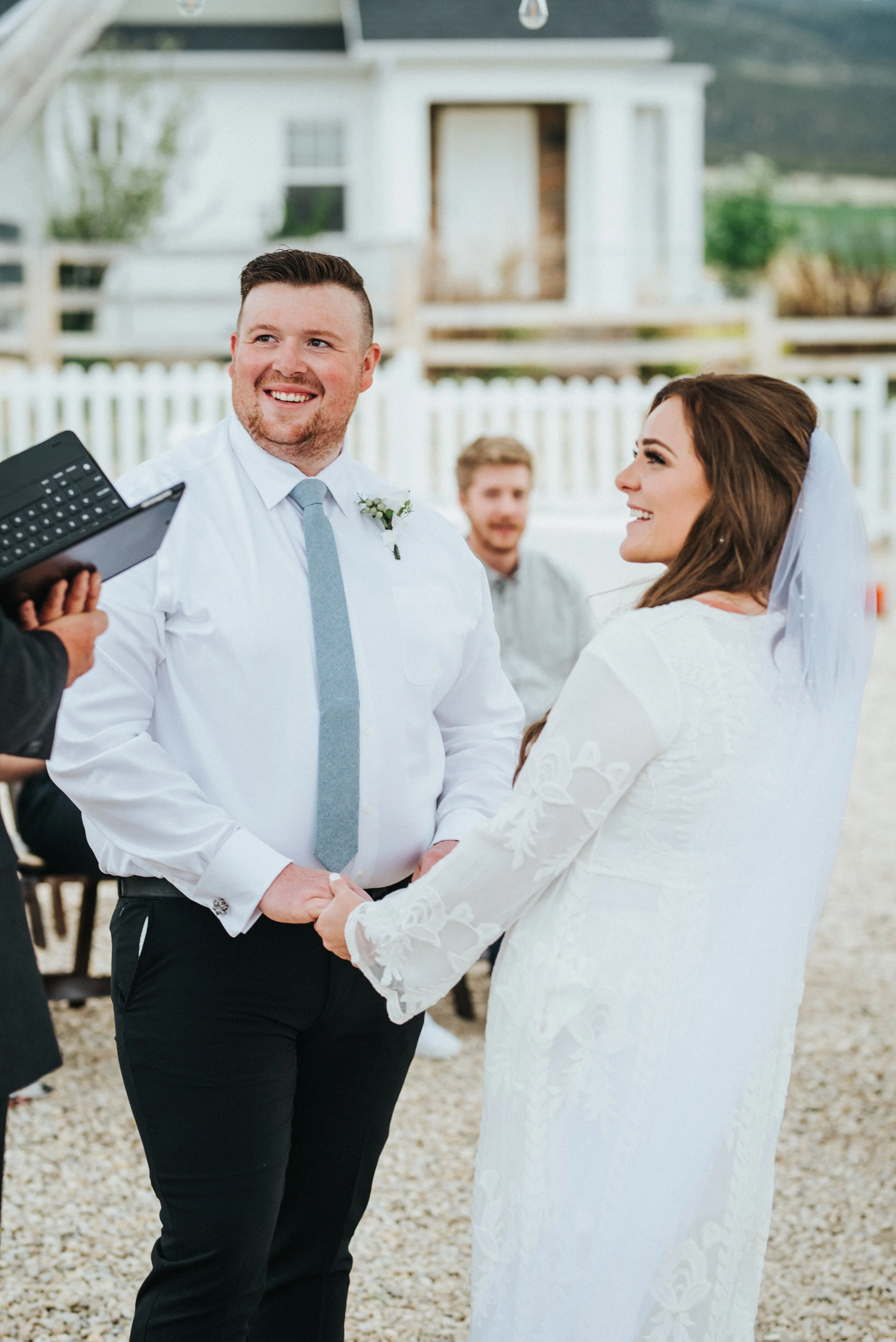  The bride and groom on their wedding day getting ready to exchange vows during their intimate outdoor wedding ceremony. photoshoot in Ephraim Utah photography wedding outdoor location western inspired rustic Airbnb photo aesthetic #ephraimutah #utah