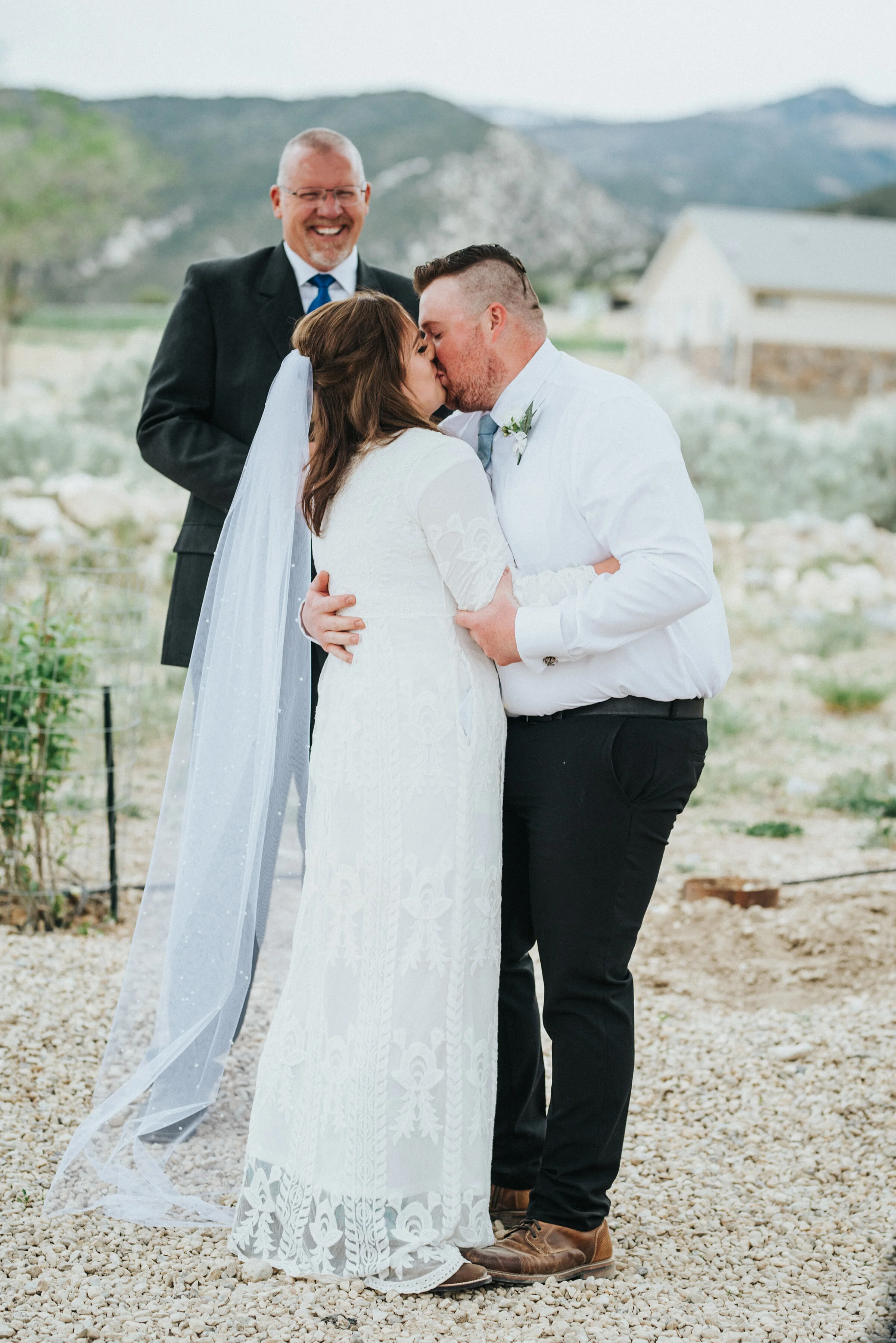  The beautiful outdoor ceremony for this western bride and groom was sealed with a kiss during their intimate wedding in Ephraim Utah.  photoshoot in Ephraim Utah photography wedding outdoor location western inspired rustic Airbnb photo aesthetic #ep