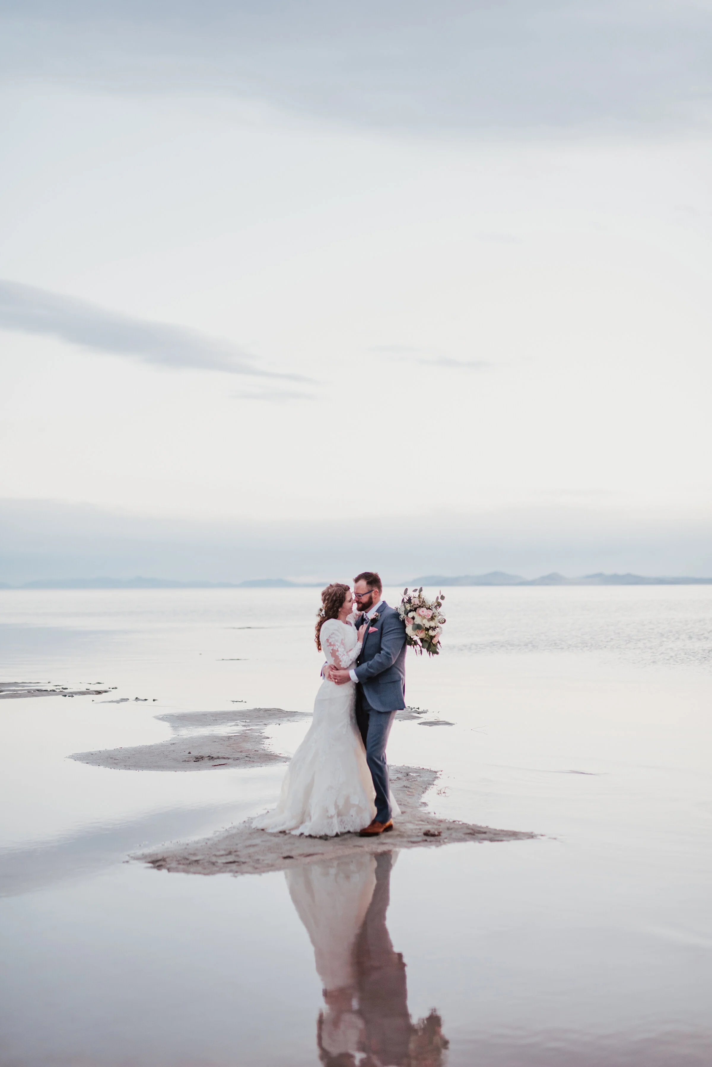  The Spiral Jetty allowed for this bride and groom to captures all of natures beauty and dimension in one photo session. Wedding formal photoshoot in Spiral Jetty Northern Utah Great Salt Lake photography wedding formals natural photo aesthetic bride