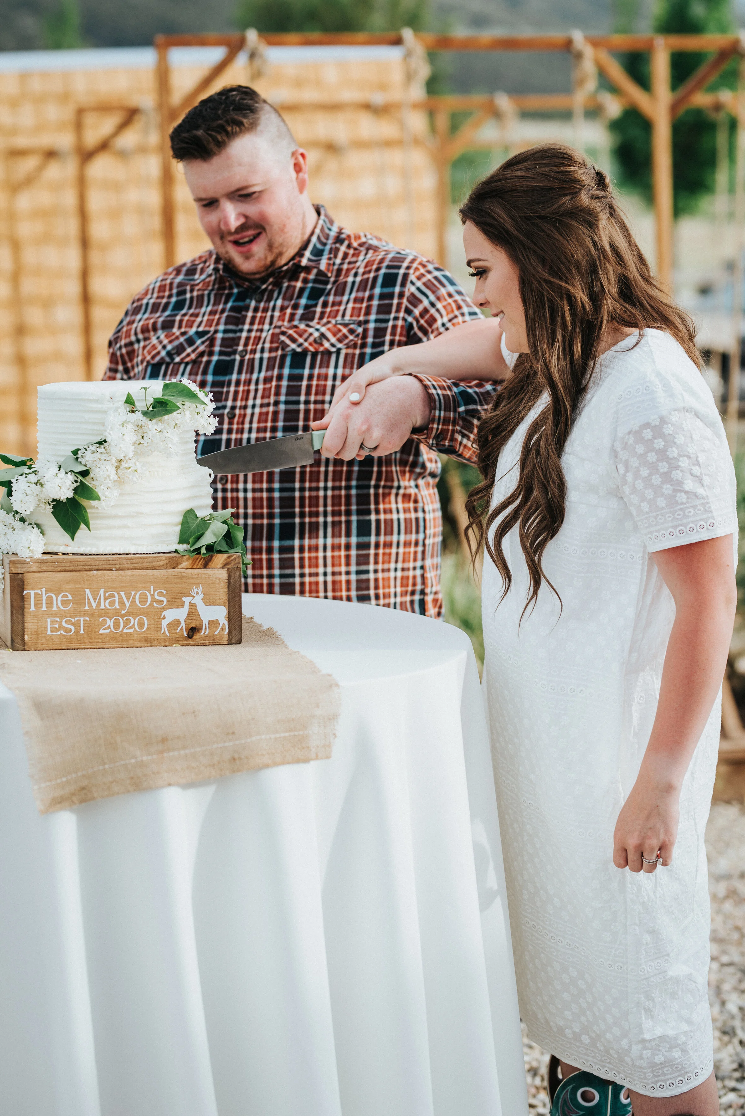 As a tradition, the bride and groom cut the gorgeous and simple wedding cake to share on their wedding day! photoshoot in Ephraim Utah photography wedding outdoor location western inspired rustic Airbnb photo aesthetic #ephraimutah #utahphotography …
