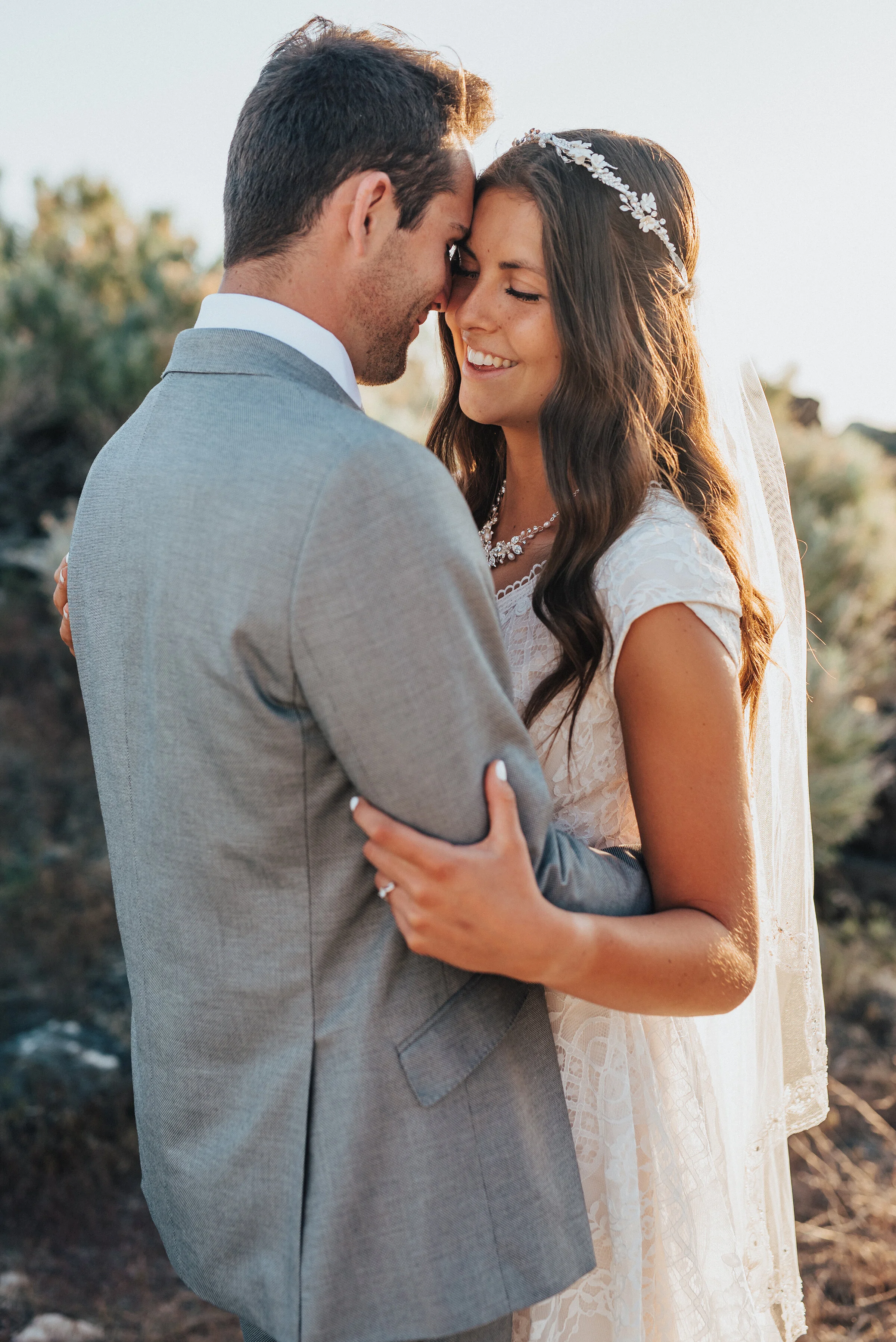  Her smile says a thousand words as the sun dances across her long cathedral veil at the Spiral Jetty in Northern Utah. elegant sweet formal session great salt lake utah photographer #spiraljetty #GreatSaltLake #formalsession #SaltFlats #sunsetphotos