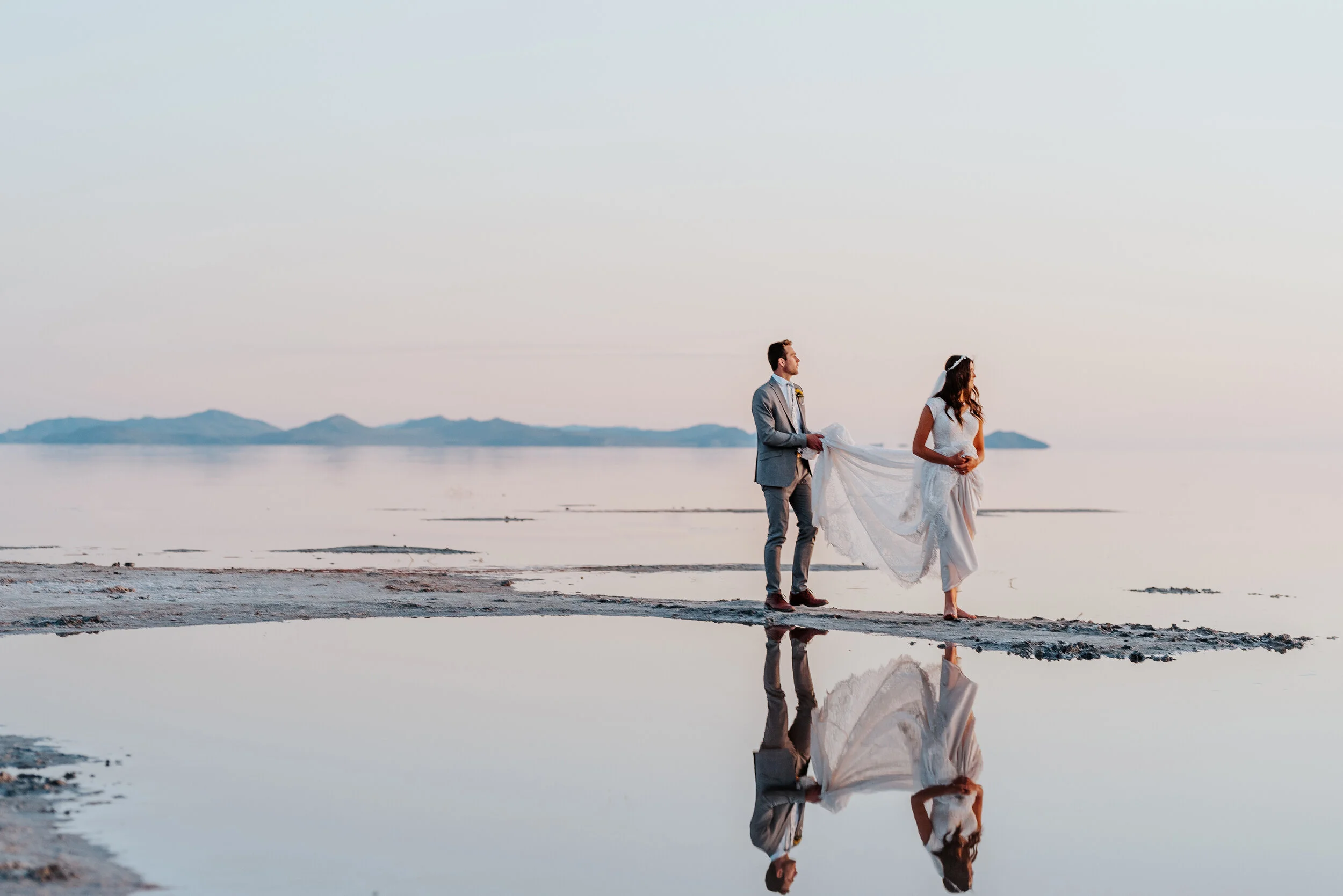  The bride and groom enjoying the last of the sunshine during their formal wedding photography session in Northern Utah. wedding photographer formal session water formals #spiraljetty #GreatSaltLake #formalsession #SaltFlats #sunsetphotosession #Nort
