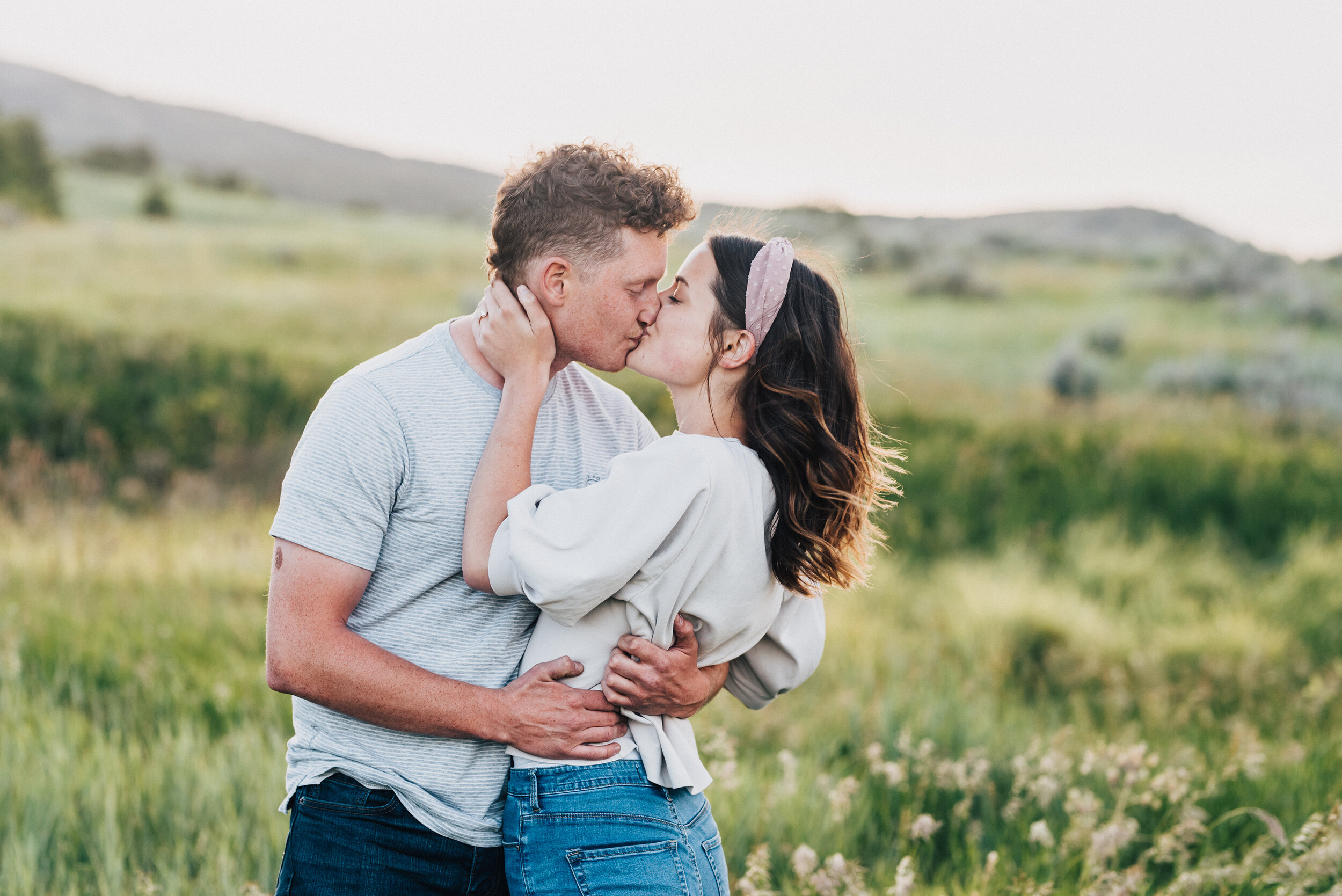 Kissing pose of the most adorable engaged couple by professional engagement photographer Kristi Alyse taken in Logan, Utah. Cache valley wedding photographer trendy outfits for engagements inspiration for couples session posing ideas outfit ideas pi…