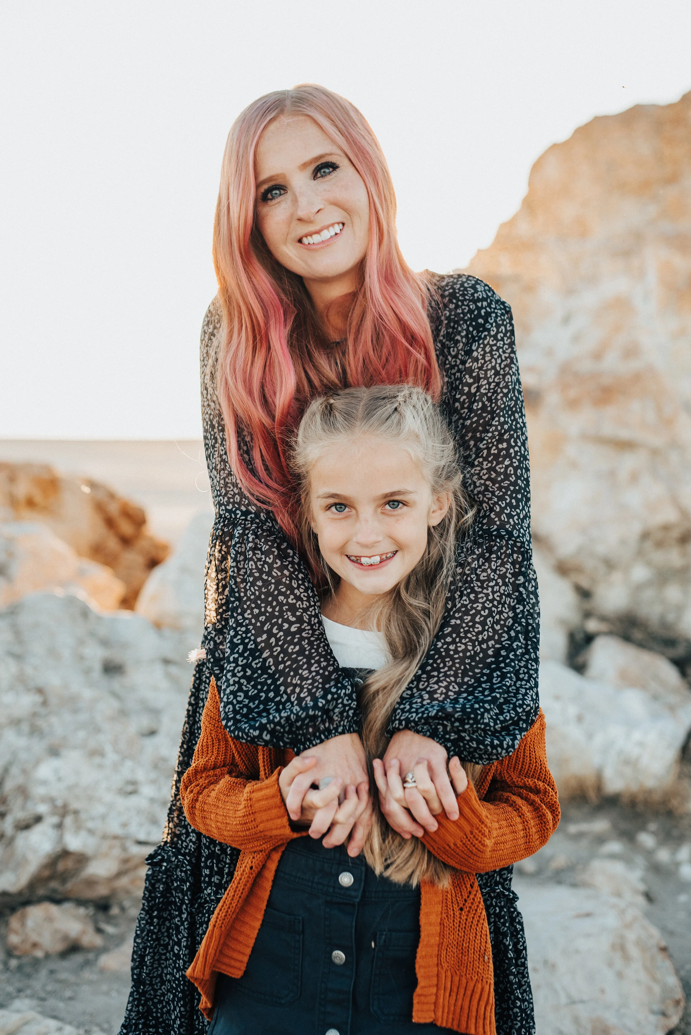  Darling shot of mother and daughter posing for family photographer Kristi Alyse Photography at Lady Finger Pointe near Antelope Island. Northen utah family photographer syracuse utah family pictures at antelope island pink hair mom and daughter fren