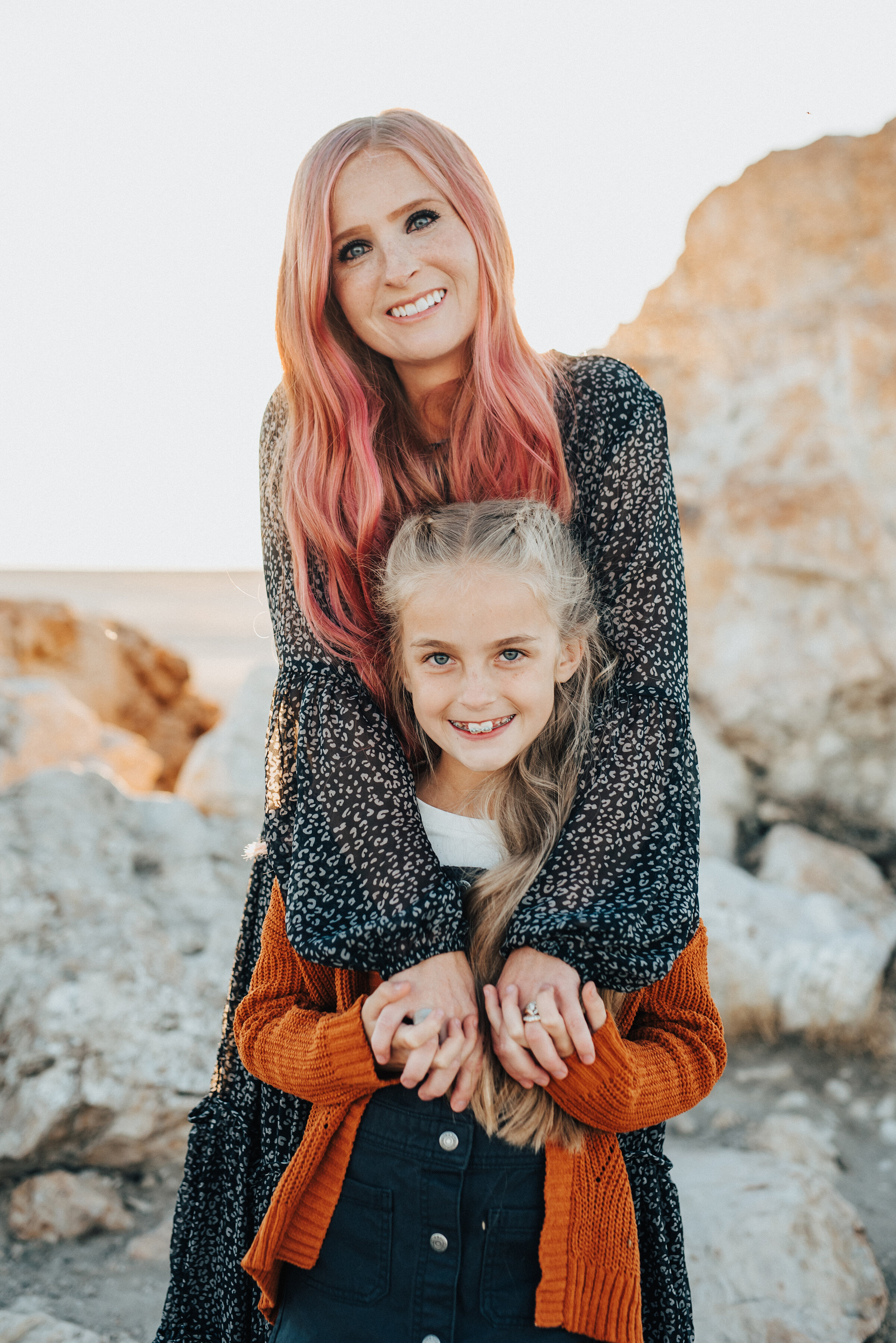  Darling shot of mother and daughter posing for family photographer Kristi Alyse Photography at Lady Finger Pointe near Antelope Island. Northen utah family photographer syracuse utah family pictures at antelope island pink hair mom and daughter french braids long hair pink hair family photos outfit inspiration #familypictures #utahphotographer #antelopeisland #outfitinspo #familypics #familyphotographer #pinkhair #saltlakecityphotog #slcfamilypictures 