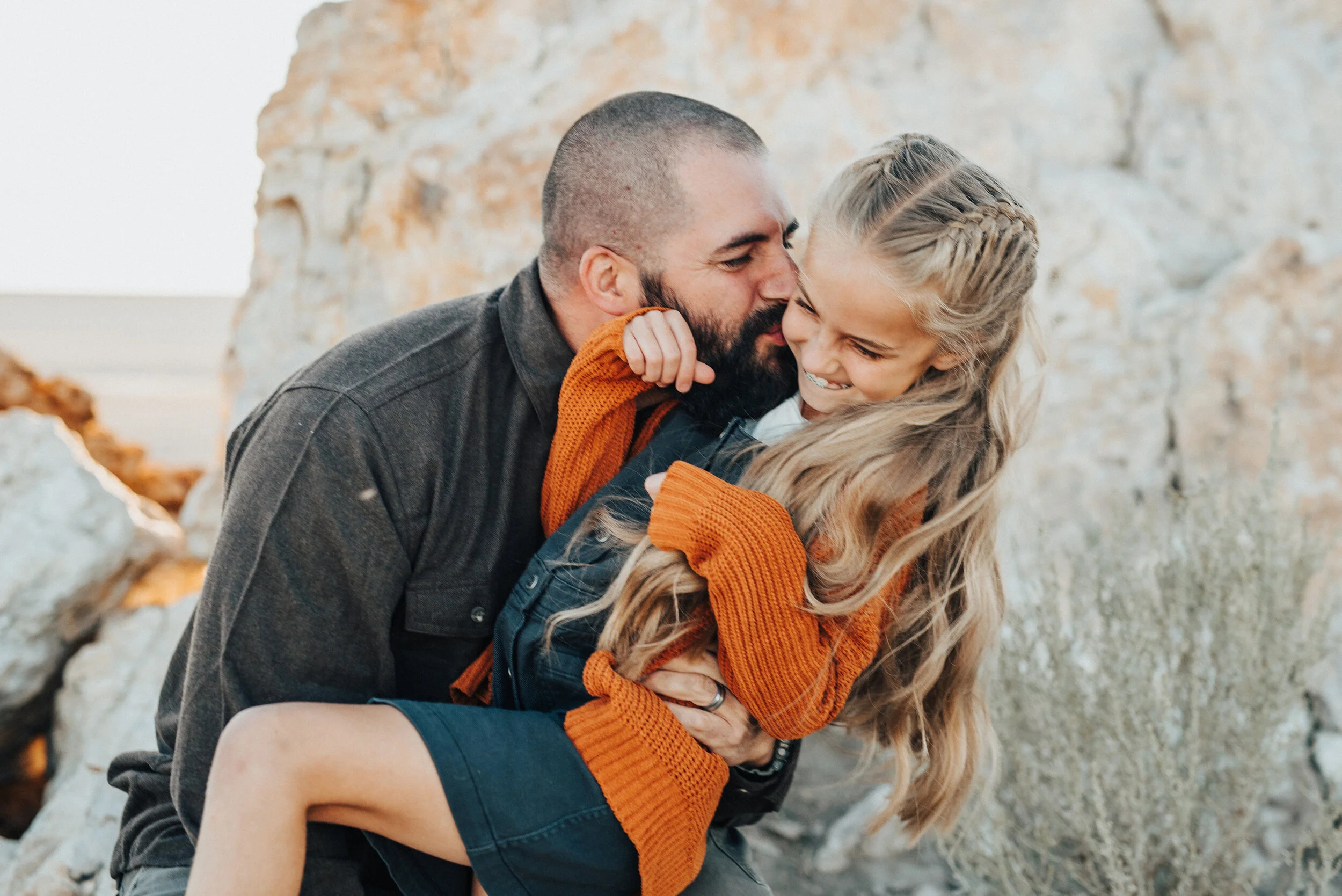 A playful father kisses and tickles his beautiful daughter in a fun Salt Lake City family photo shoot by Kristi Alyse Photography. Fall family portraits father and daughter relationship goals professional Utah photographer fall girl attire inspirati…