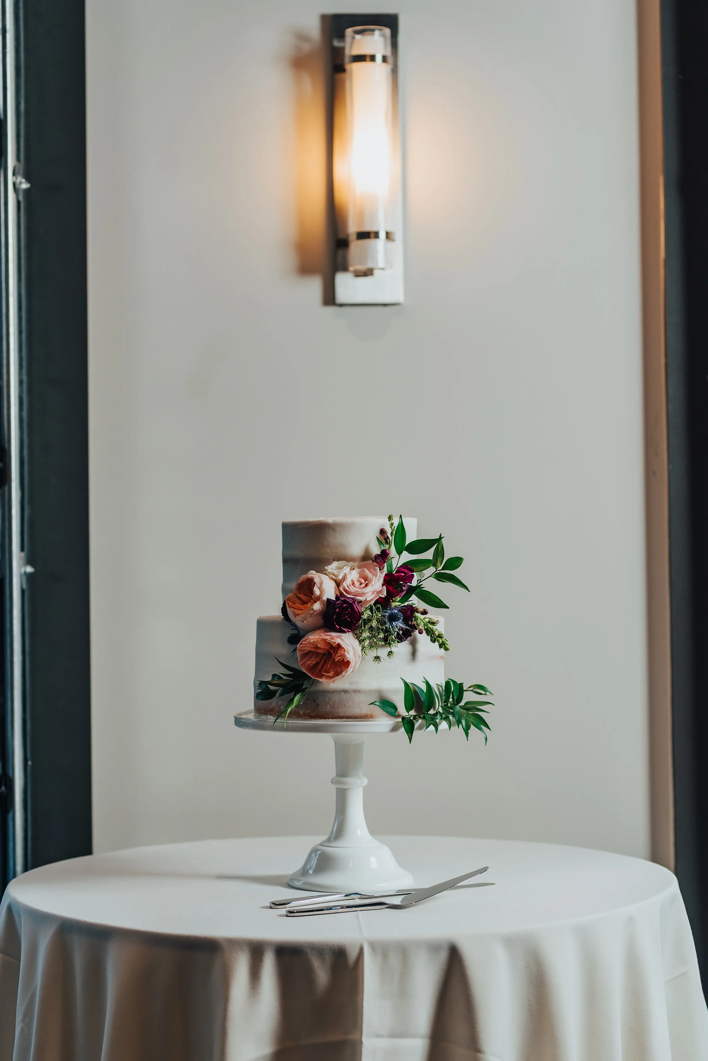  Beautiful floral and nude wedding cake shot in Logan, Utah shot by Kristi Alyse Photography. Vanilla nude cake floral arrangement wedding cake quality photos Kristi Alyse cake traditions simple details bride and grooms cake #weddinginspo #loganutah 