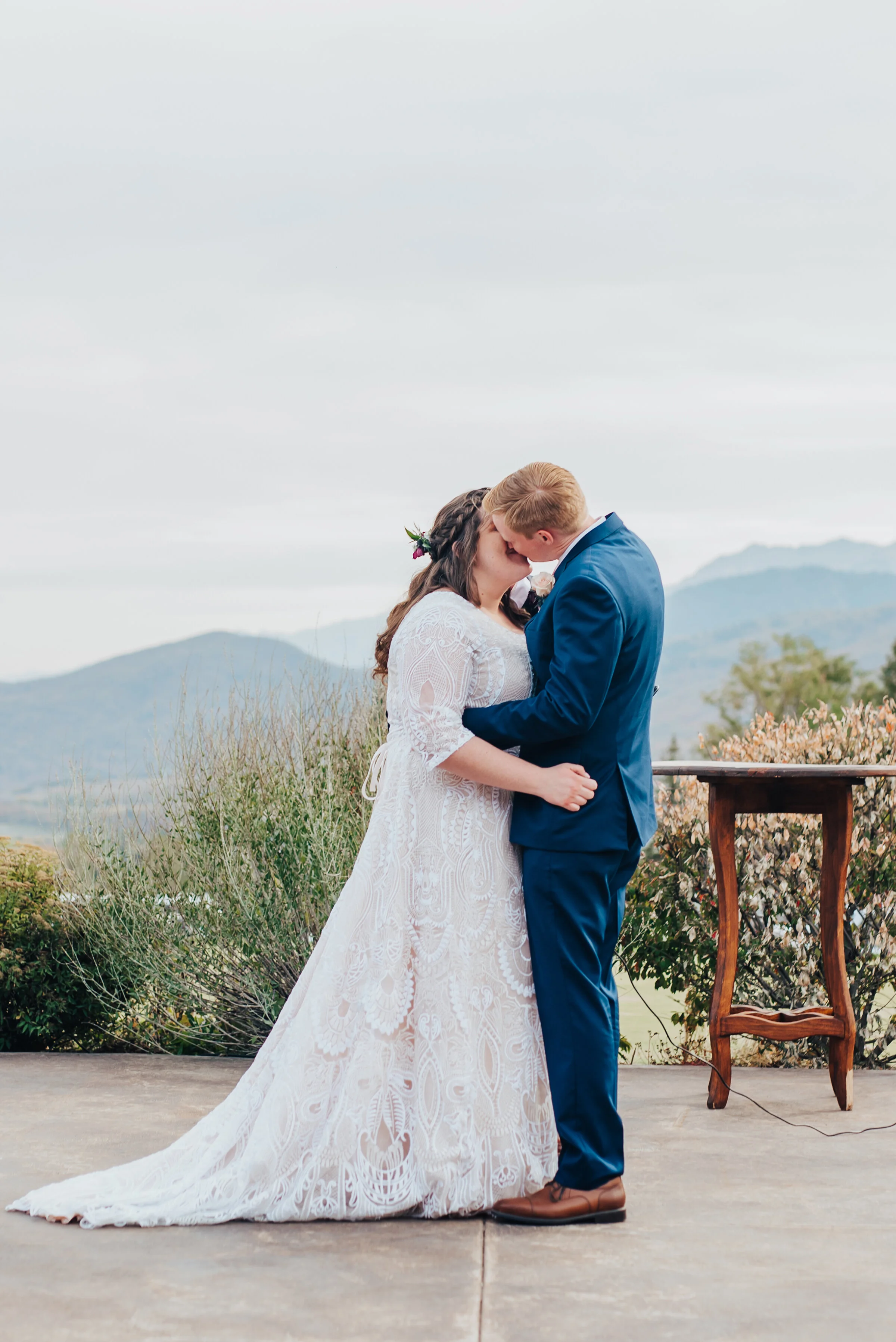  First kiss as husband and wife in the mountains of northern Utah captured by Kristi Alyse photography. First kiss husband and wife bride and groom mountain Logan Utah wedding ceremony location inspiration wedding photography unique meaningful moment