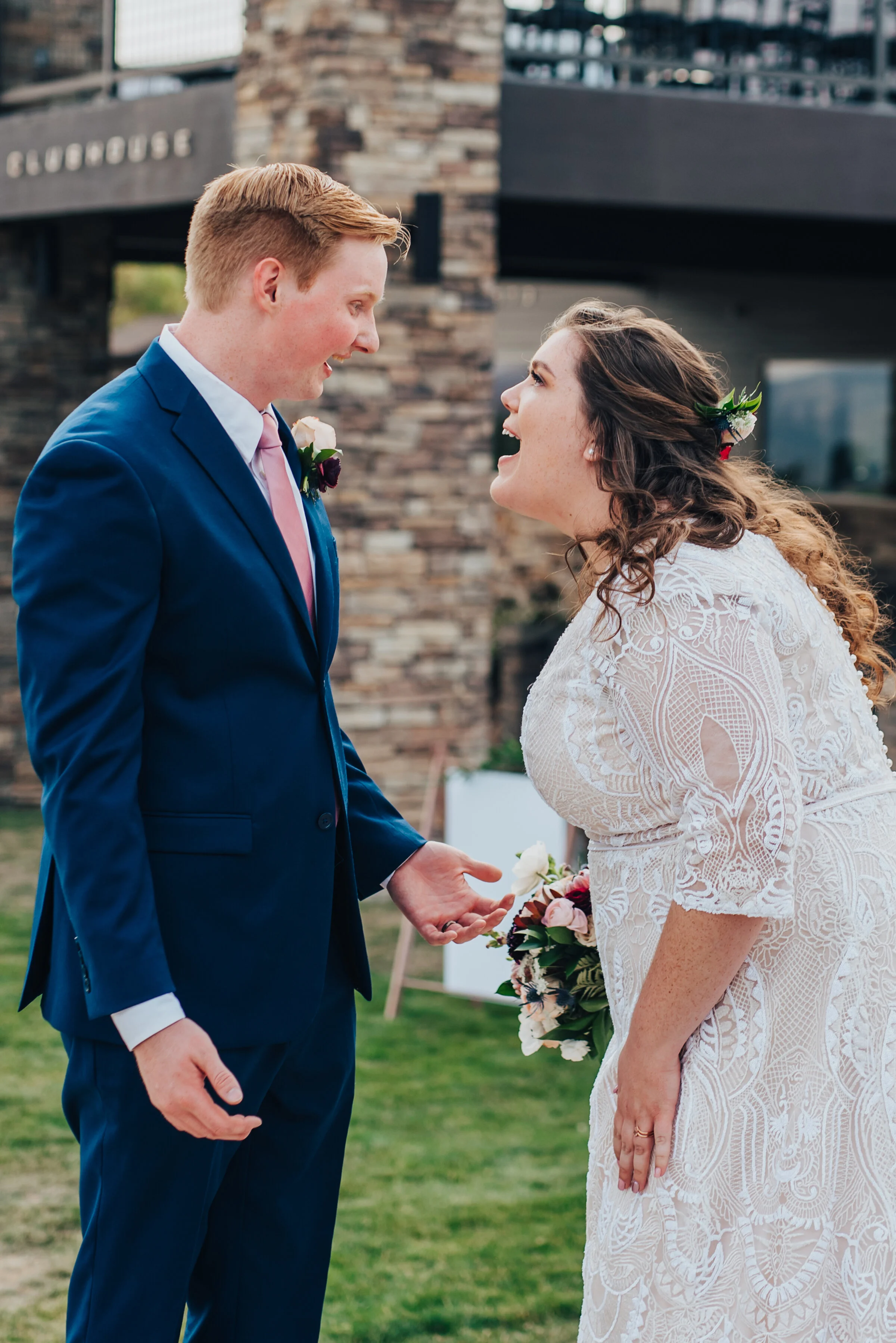  Fun shot of the bride and groom in this northern Utah wedding shot by Kristi Alyse photography. Bride and groom candid moments faces of the bride and groom blue suit white wedding dress inspo photography Utah bride logan Utah love story mountains ba