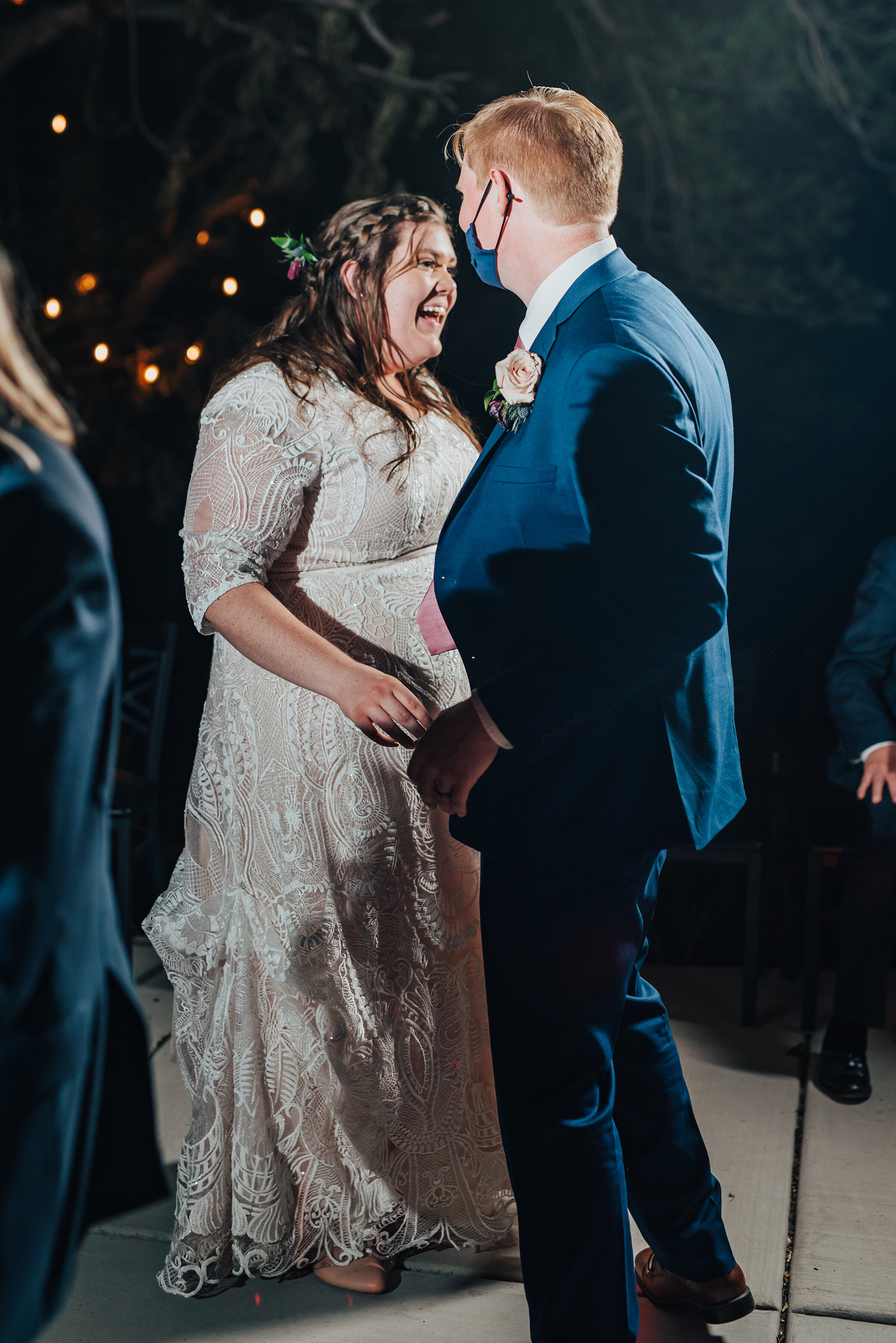 The moment the bride and groom say farewell to guests in Logan, Utah wedding shot by Kristi Alyse photography. Bride and groom escape send off honey moon wedding day inspo laughter in the night time northern Utah Kristi Alyse photography Utah bride …