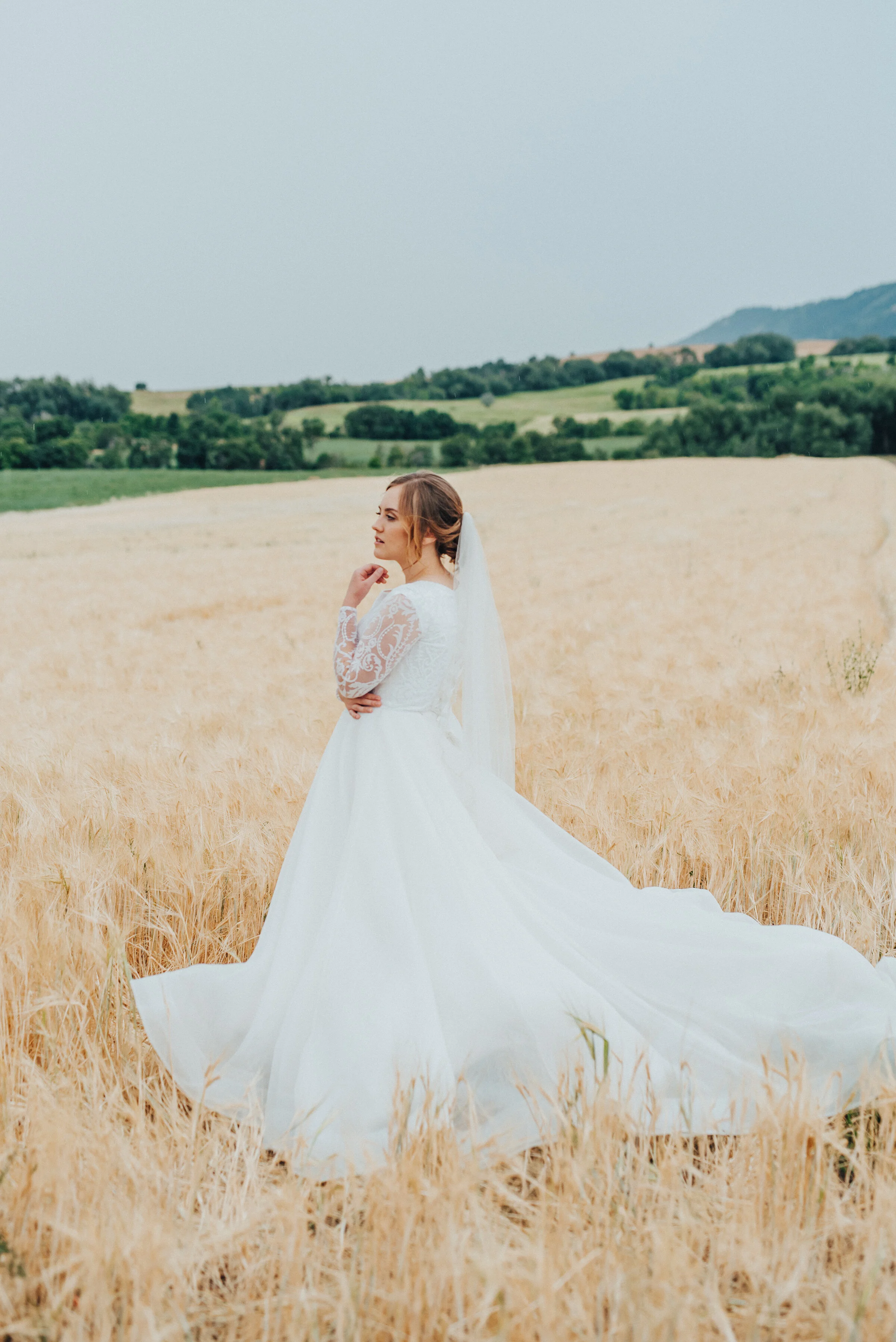  A bridal session out of a fairytale - Kristi Alyse Photography captured every romantic detail including a laced ballgown wedding dress, long grass and rolling green hills at this Logan, Utah session. long trained ballgown wedding dress, laced long s