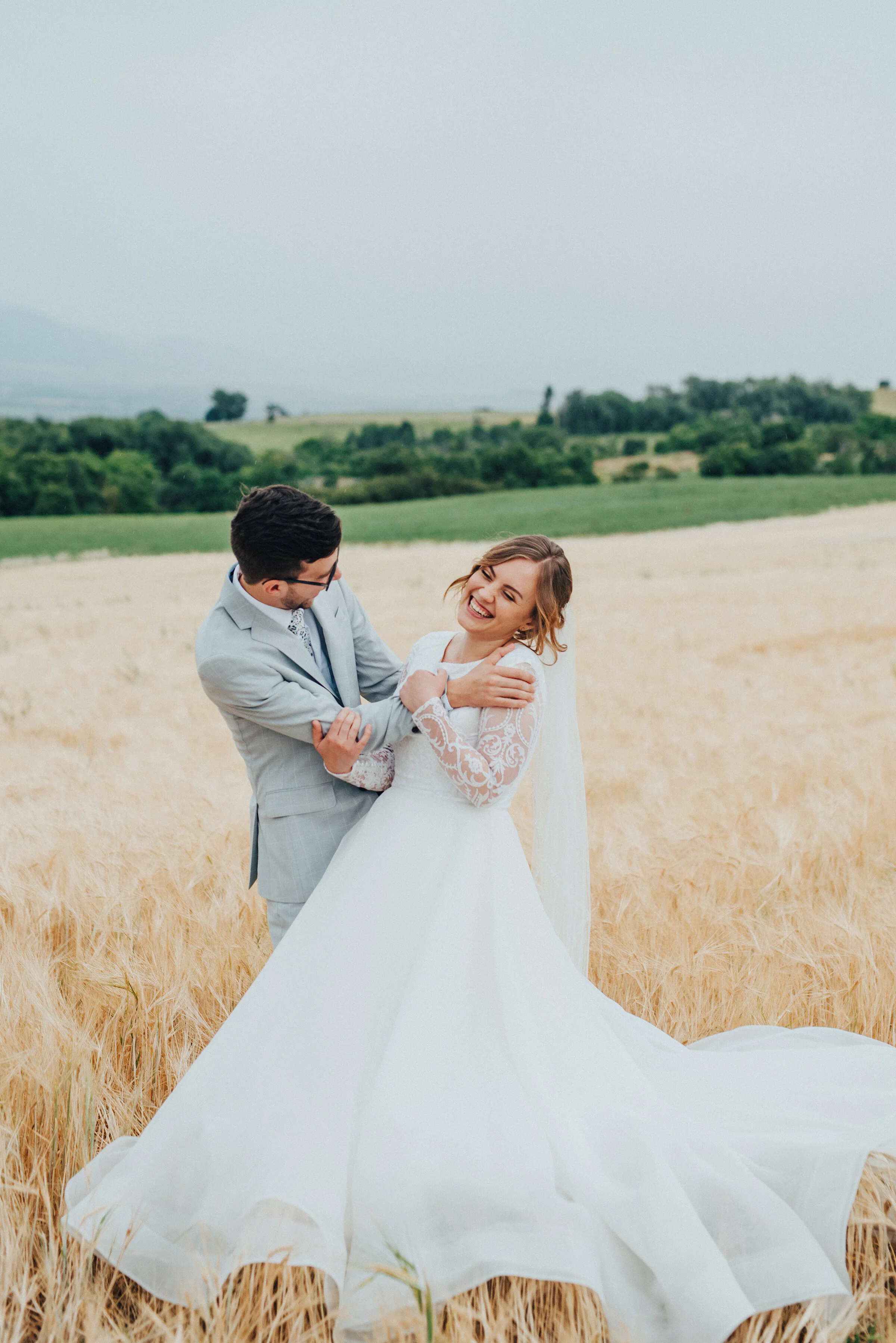  A play-filled bridal session, this photo by Kristi Alyse Photography in Logan, Utah, is full of movement, joy and flirty bridal joy! bride and groom laughing, bride and groom playful bridal session, professional logan utah wedding photographer, long