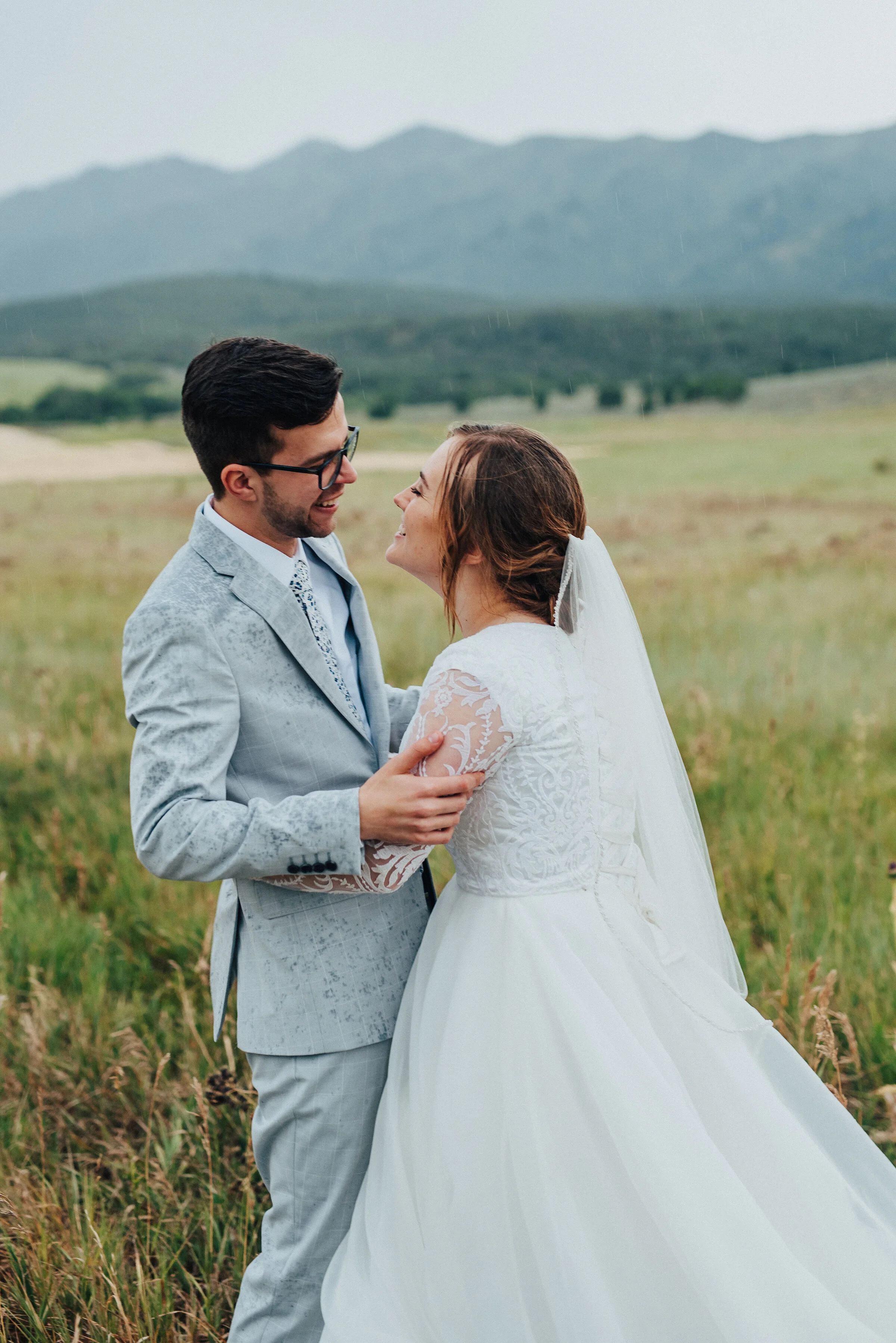  This Cache Valley, Utah bridal session by Kristi Alyse Photography was filled with stolen kisses and impending wedding day glee. hugging in the rain, romantic bridal session, kissing in the rain, logan utah wedding photographer, green utah rolling h