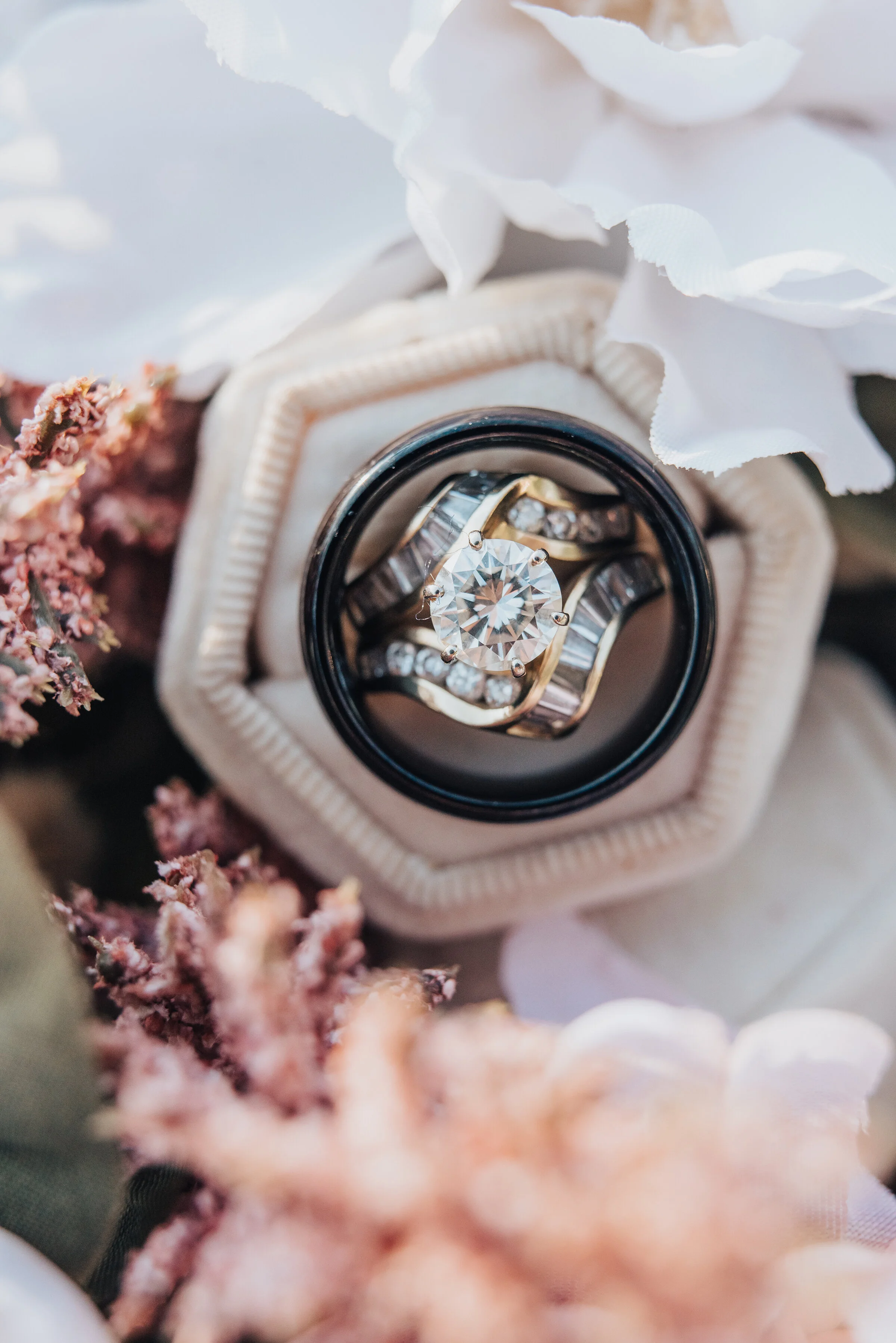 This wedding ring detailed shot taken by Kristi Alyse Photography in Cache Valley Utah is beautifully framed by beautiful blush pink and white wedding florals. professional wedding photographer in logan utah, kristi alyse photography, detailed weddi…