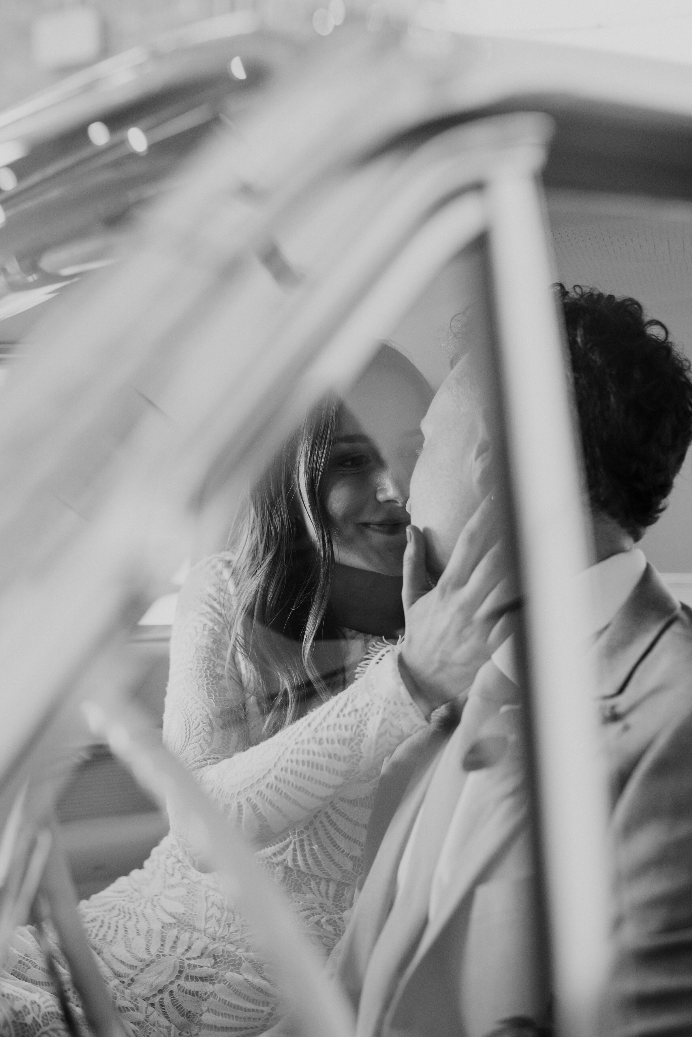  Quiet moments between husband and wife in their vintage getaway car - Kristi Alyse Photography captures all the important in-between wedding moments in Provo, Utah. vintage getaway car, bohemian styled wedding, brides hand on grooms face, vintage we