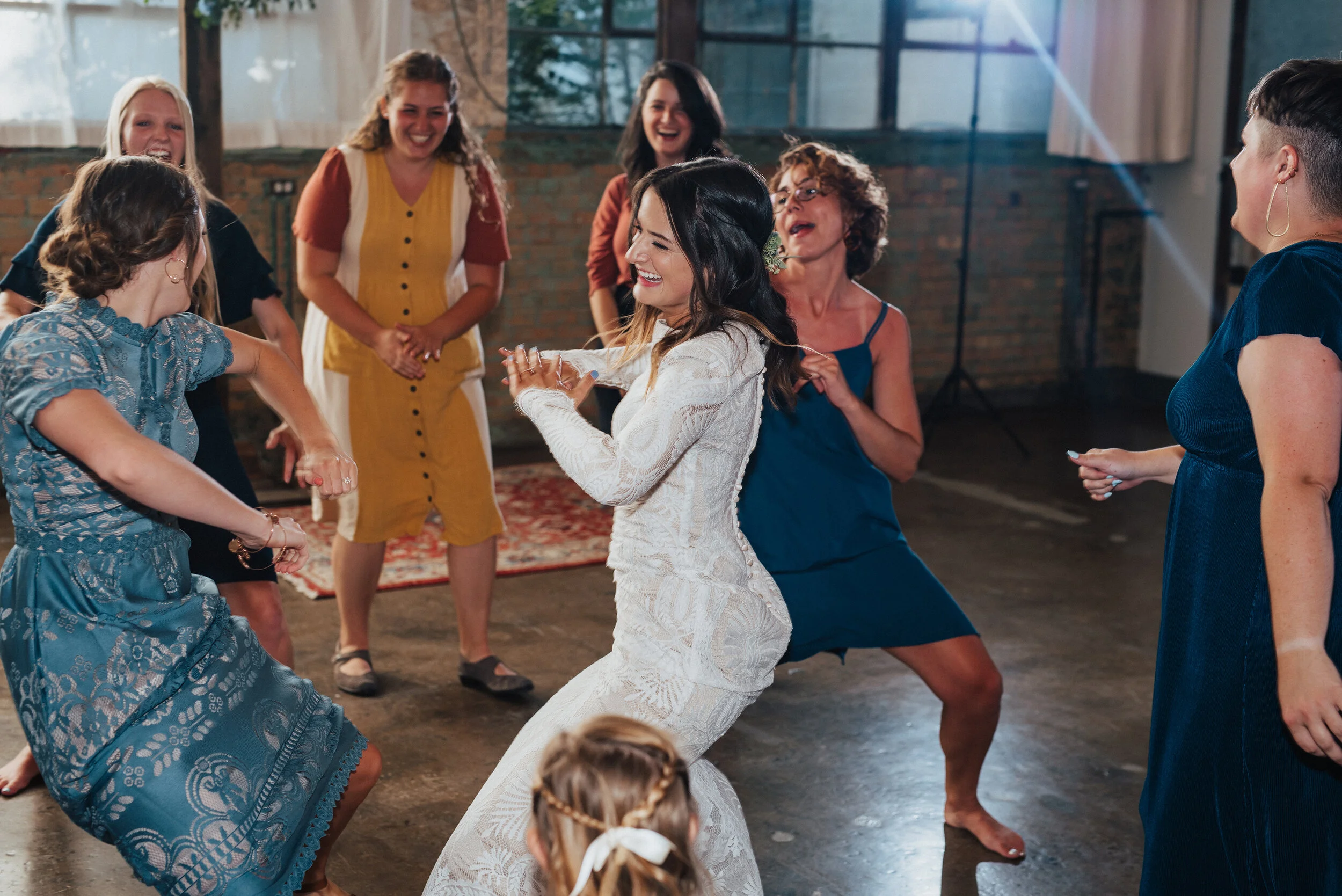  Kristi Alyse Photography captures energy and fun during the dancing portion of this bohemian-styled bride’s wedding reception at the Bright Building in Provo, Utah. reception dancing photos, bohemian wedding dress, loose curled bohemian wedding hair