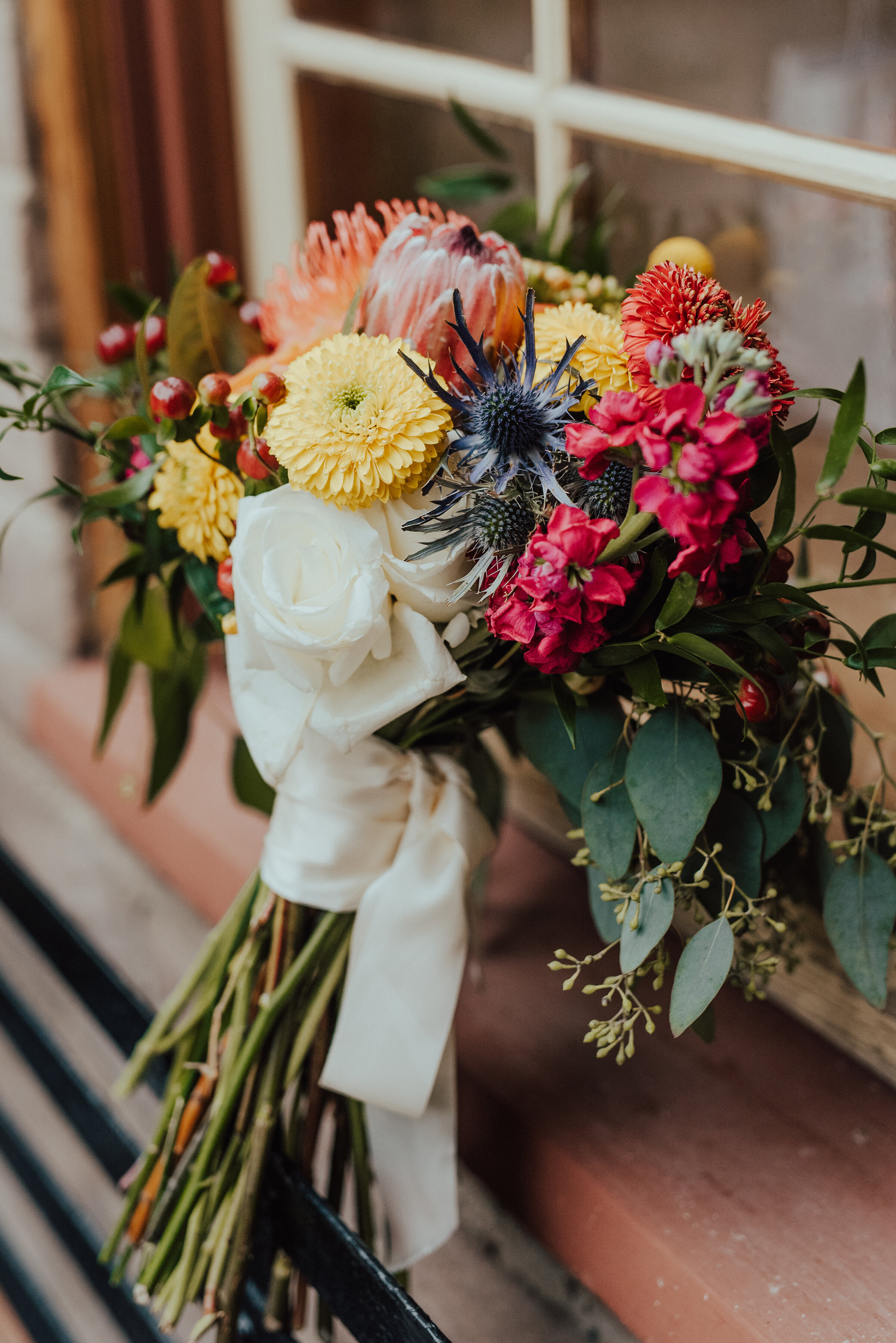  Gorgeous bridal bouquet for boho wedding with reds and yellows and blacks in Northern Utah by Kristi Alyse Photography. bridal flowers inspo bride bouquet inspo boho wedding flowers boho wedding colors red and black wedding colors dark and moody wed