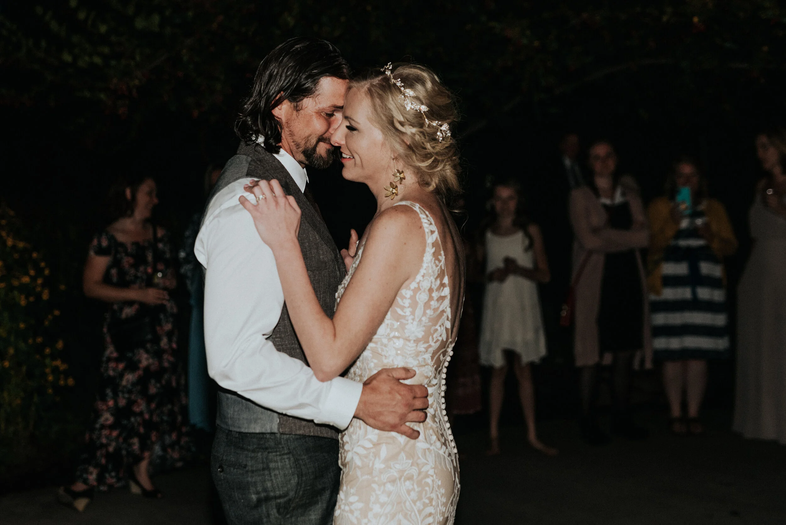  Couple dancing during wedding in nude lace wedding dress with dark gray vest suit by Kristi Alyse Photographer in Northern Utah. dancing at wedding the wedding dance how to plan the wedding dance best songs to dance to at wedding playlists for weddi