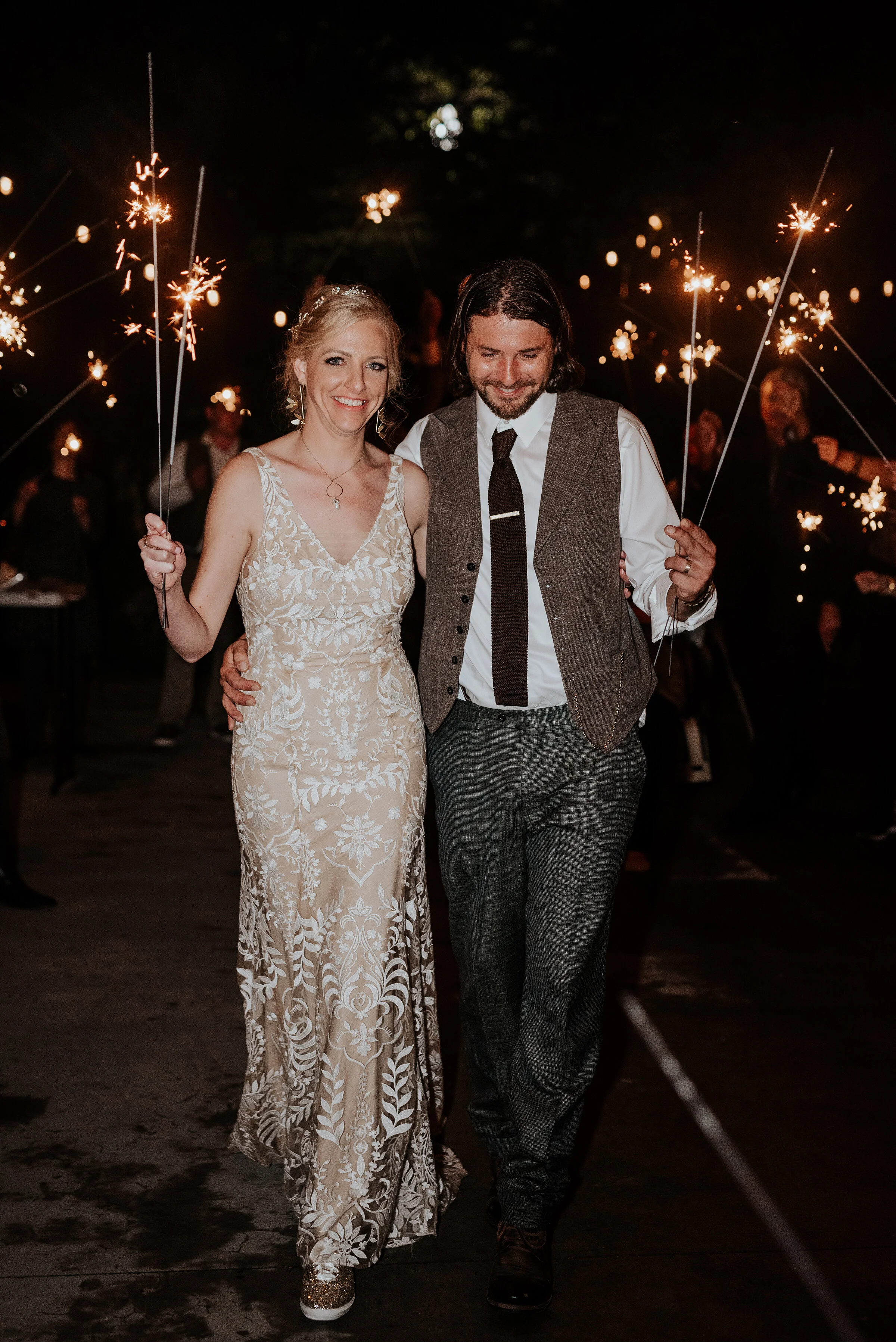 Bride and groom exiting their boho wedding with sparklers in Northern Utah by Kristi Alyse Photography. how to exit a wedding ideas to exit a wedding sparklers at a wedding how to plan a boho wedding best way to leave a wedding boho chic wedding pla…