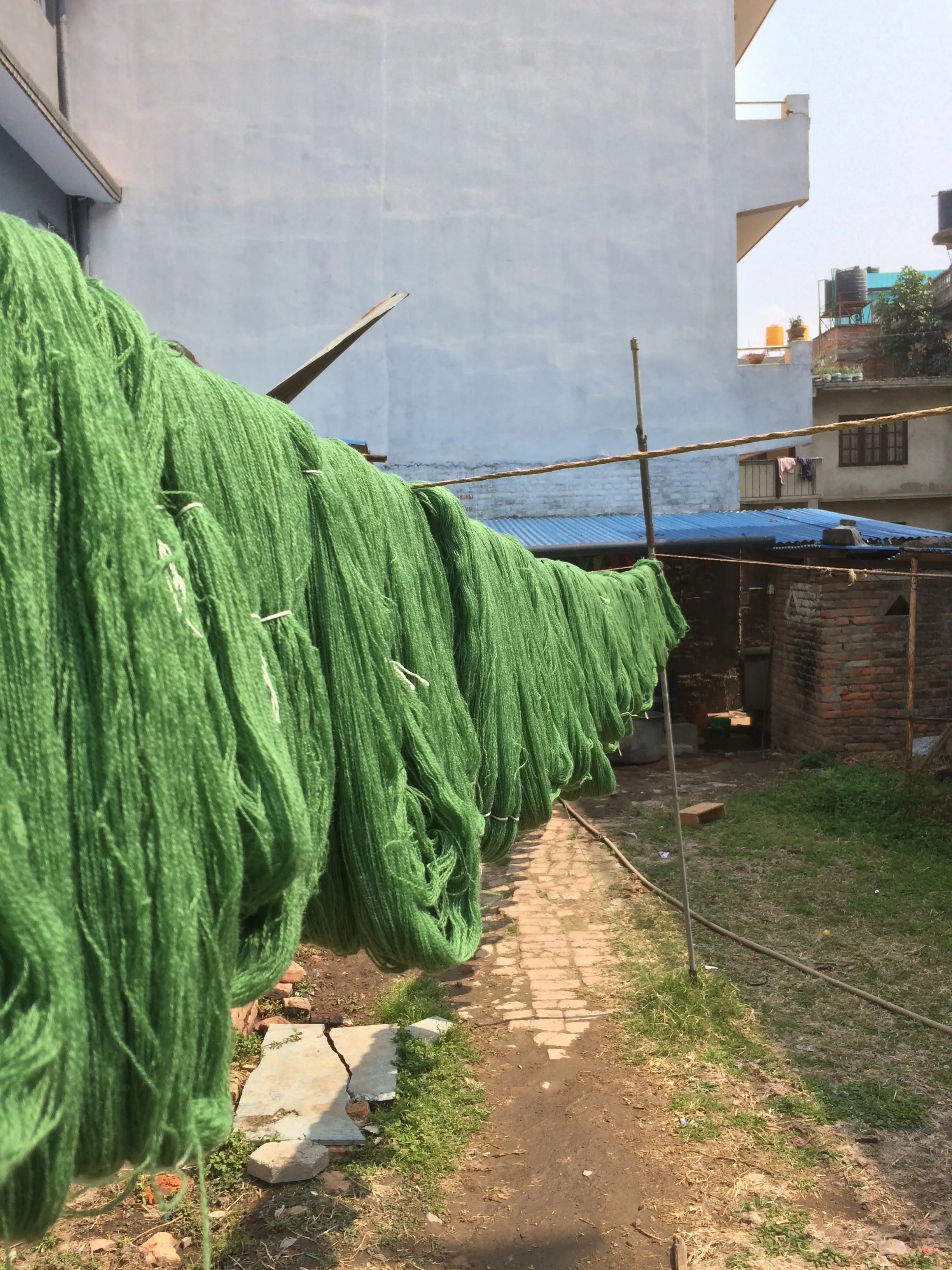 Wool, above, and linen, below, drying in the warm Nepali sun