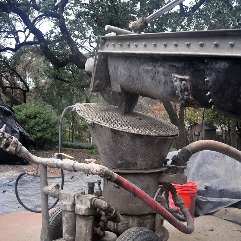 Dry shotcrete mix going into the hopper out on the street.