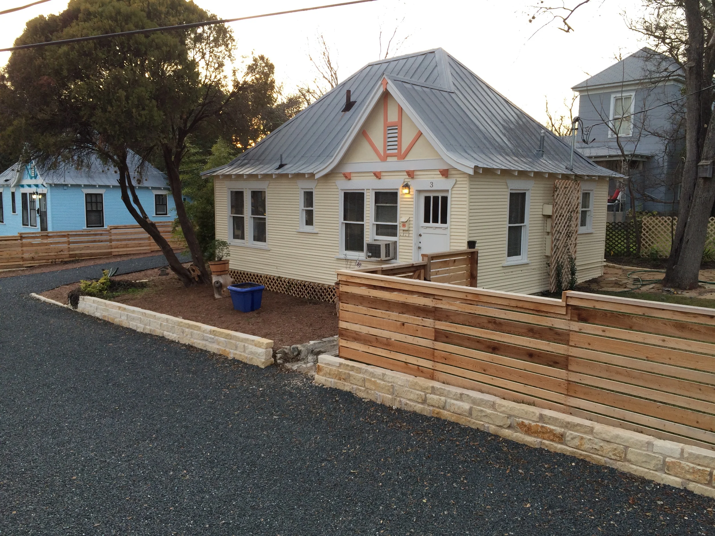 The steeply pitched roof and false half timbered tympanum are hallmarks of the Calcasieu cottages.