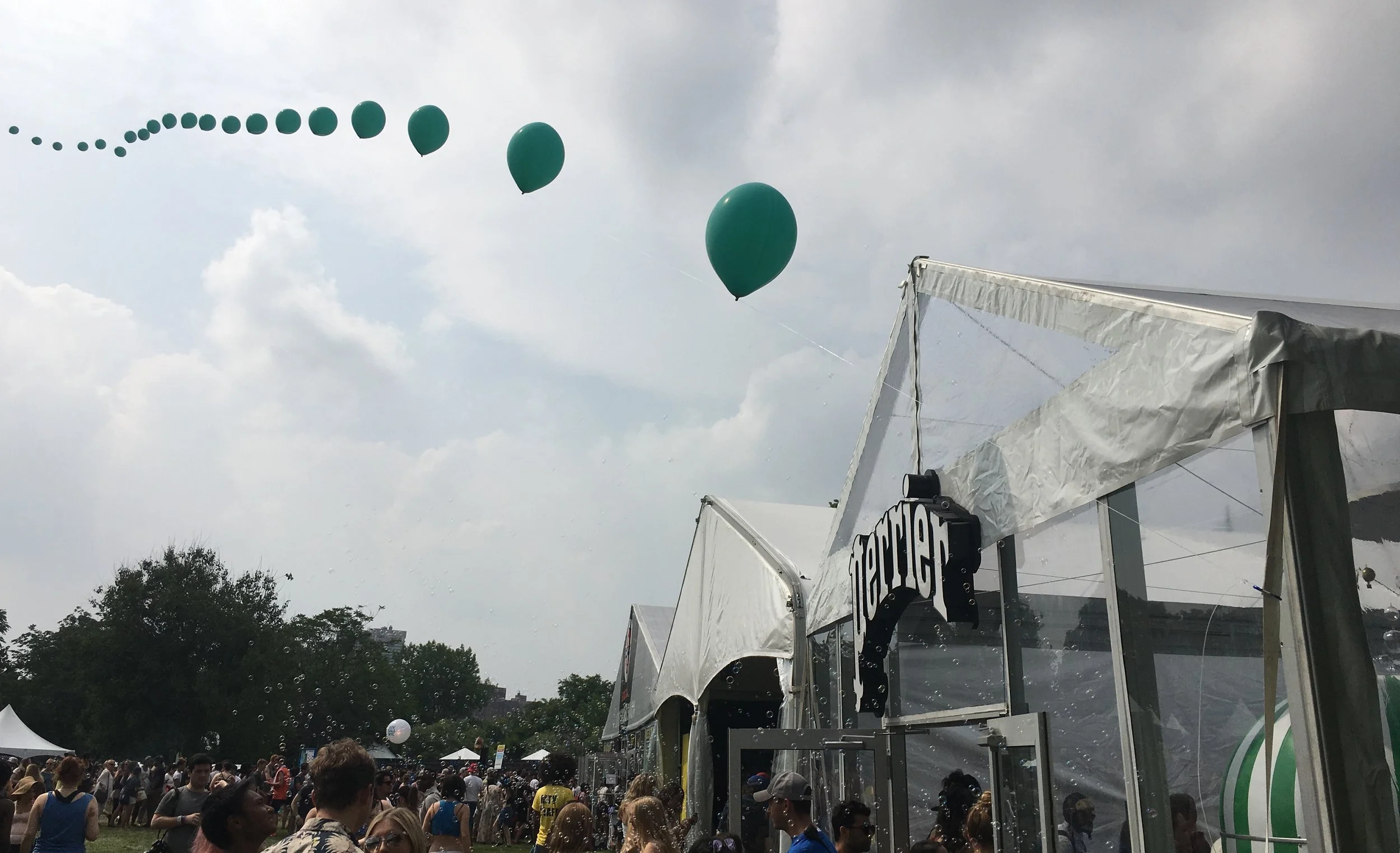 An almost endless trail of green balloons pointed festival-goers to Perrier's House of Extraordinaire.&nbsp;