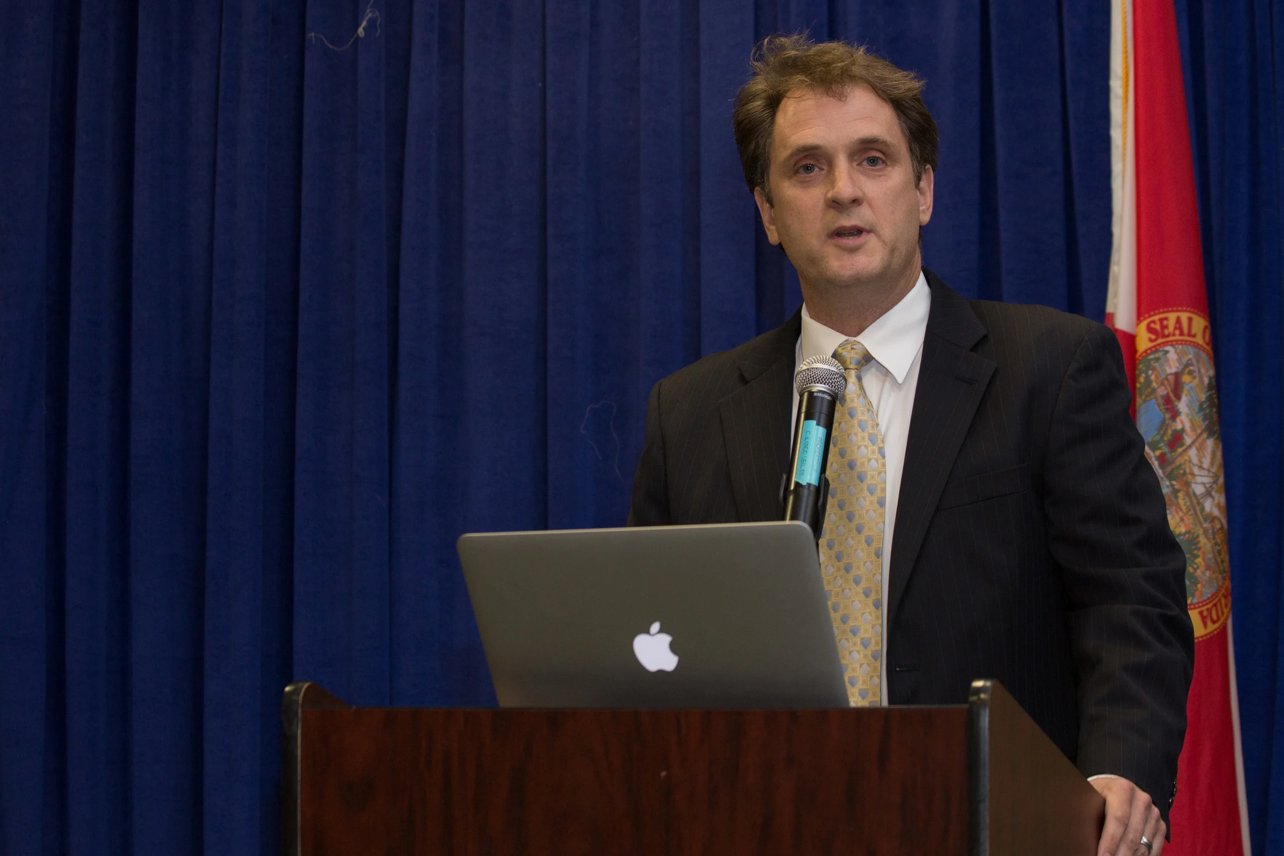 Phil Hissom speaking.jpg