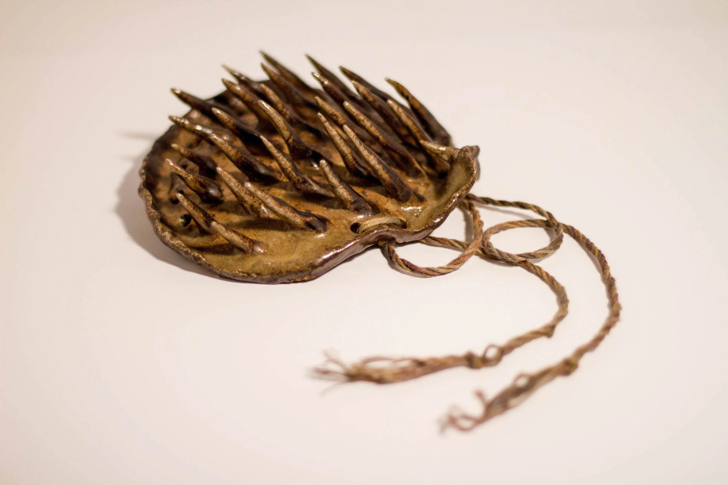 Shoulderplate. 2013. Wood fired stoneware, Detroit green clay.
